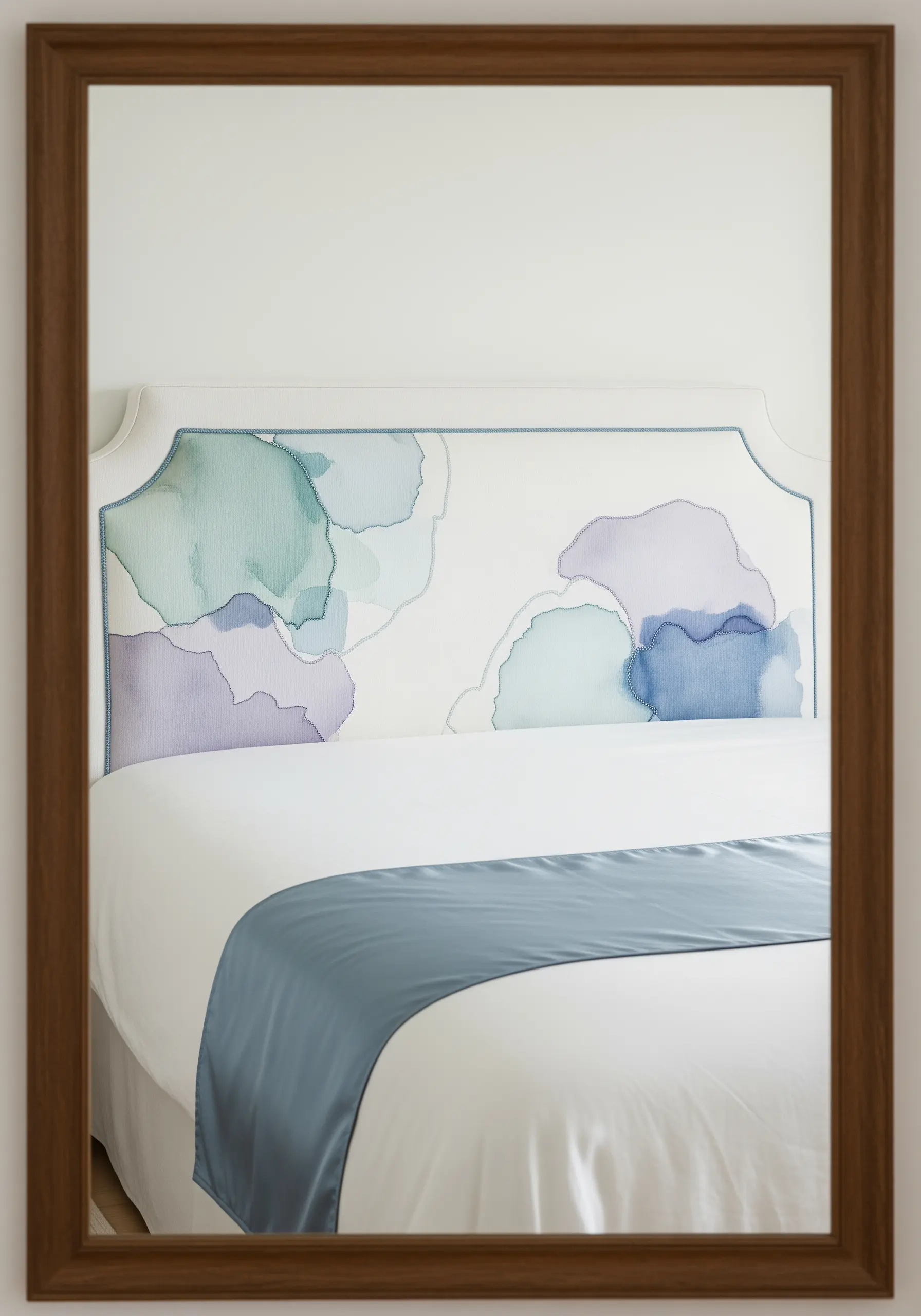 Abstract watercolor splotches on a headboard outlined with a simple running stitch.