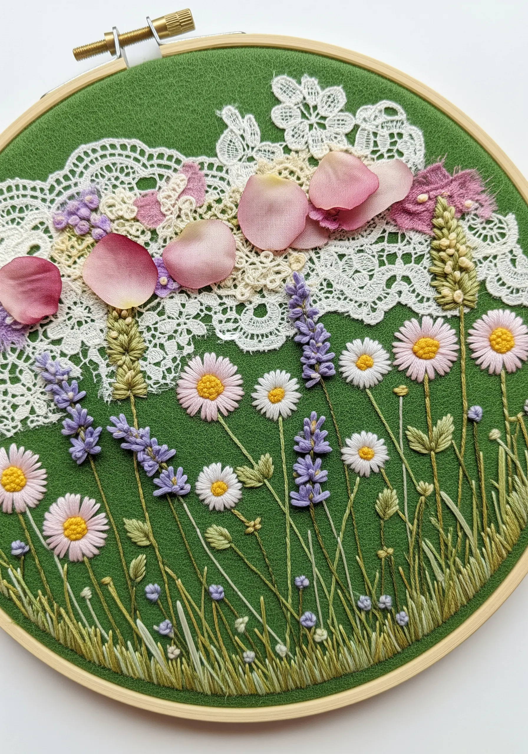 Embroidered wildflower meadow with a background of white lace and loose pink petals.