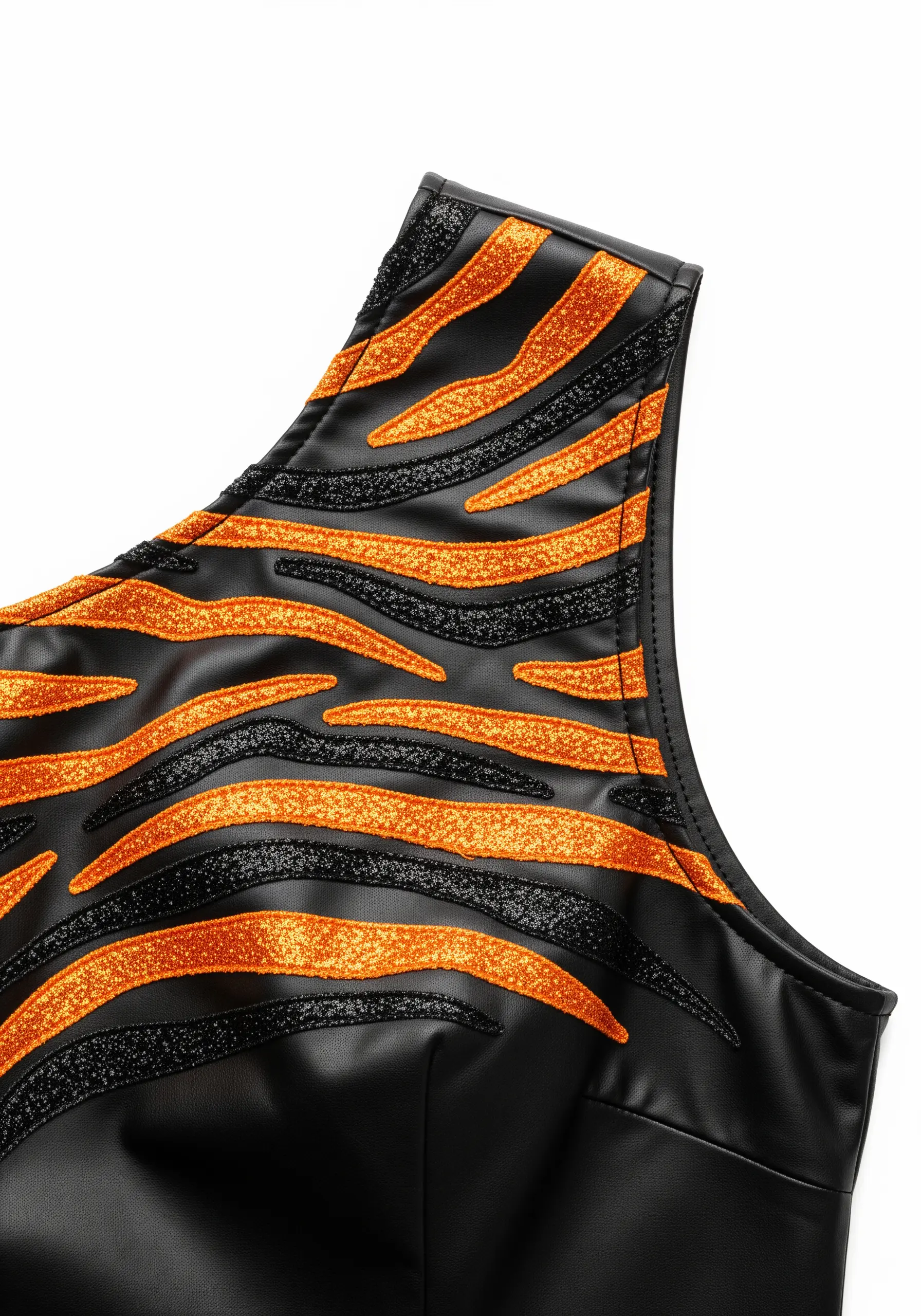 Orange and black glitter tiger stripes embroidered on a black faux leather top.