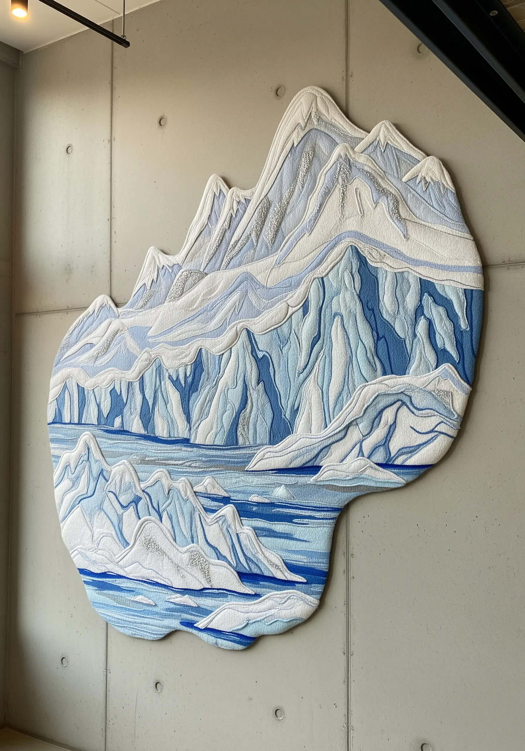 Irregularly shaped embroidery of an icy mountain