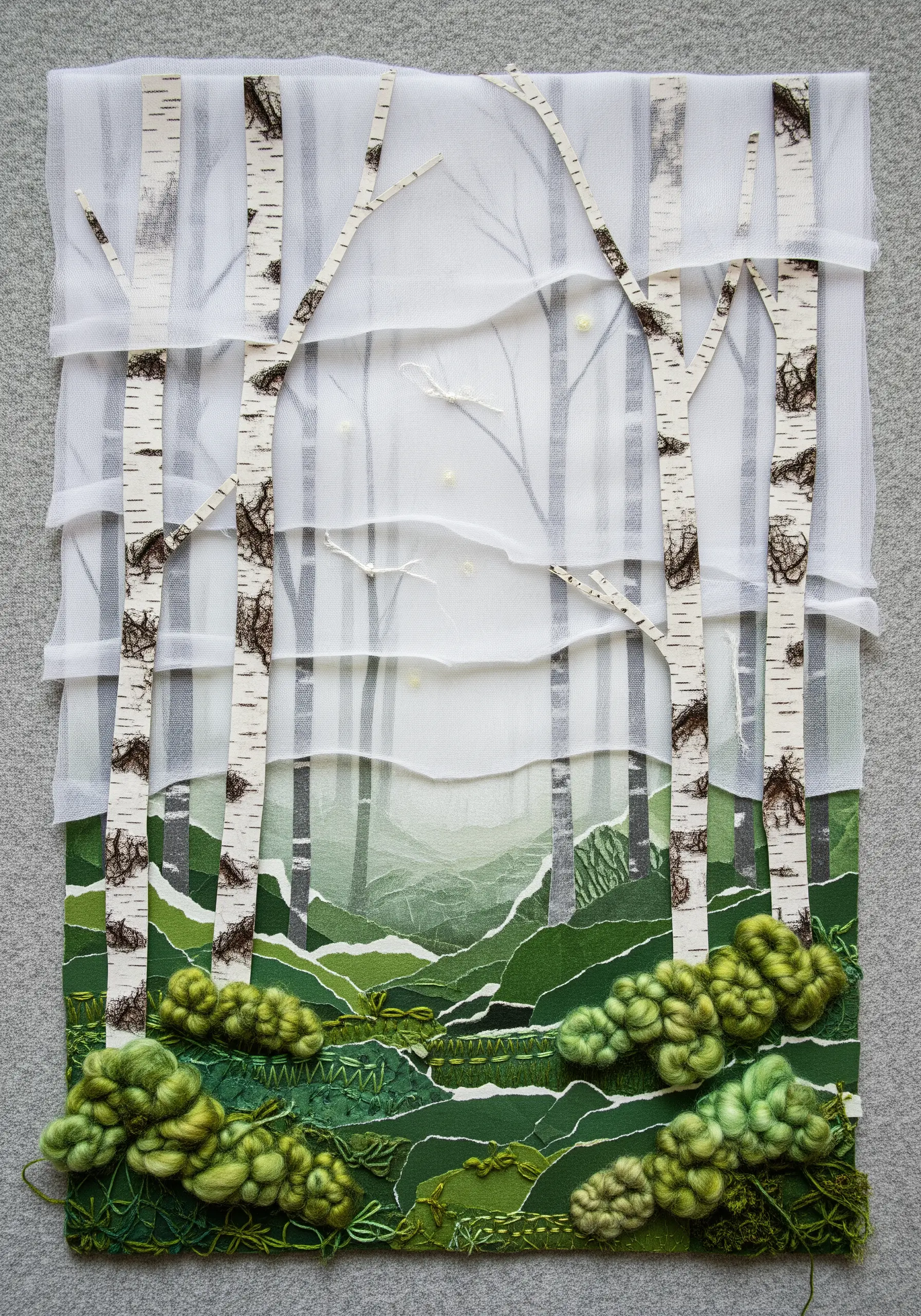 Birch tree collage with a textured foreground of green French knots and bullion knots.