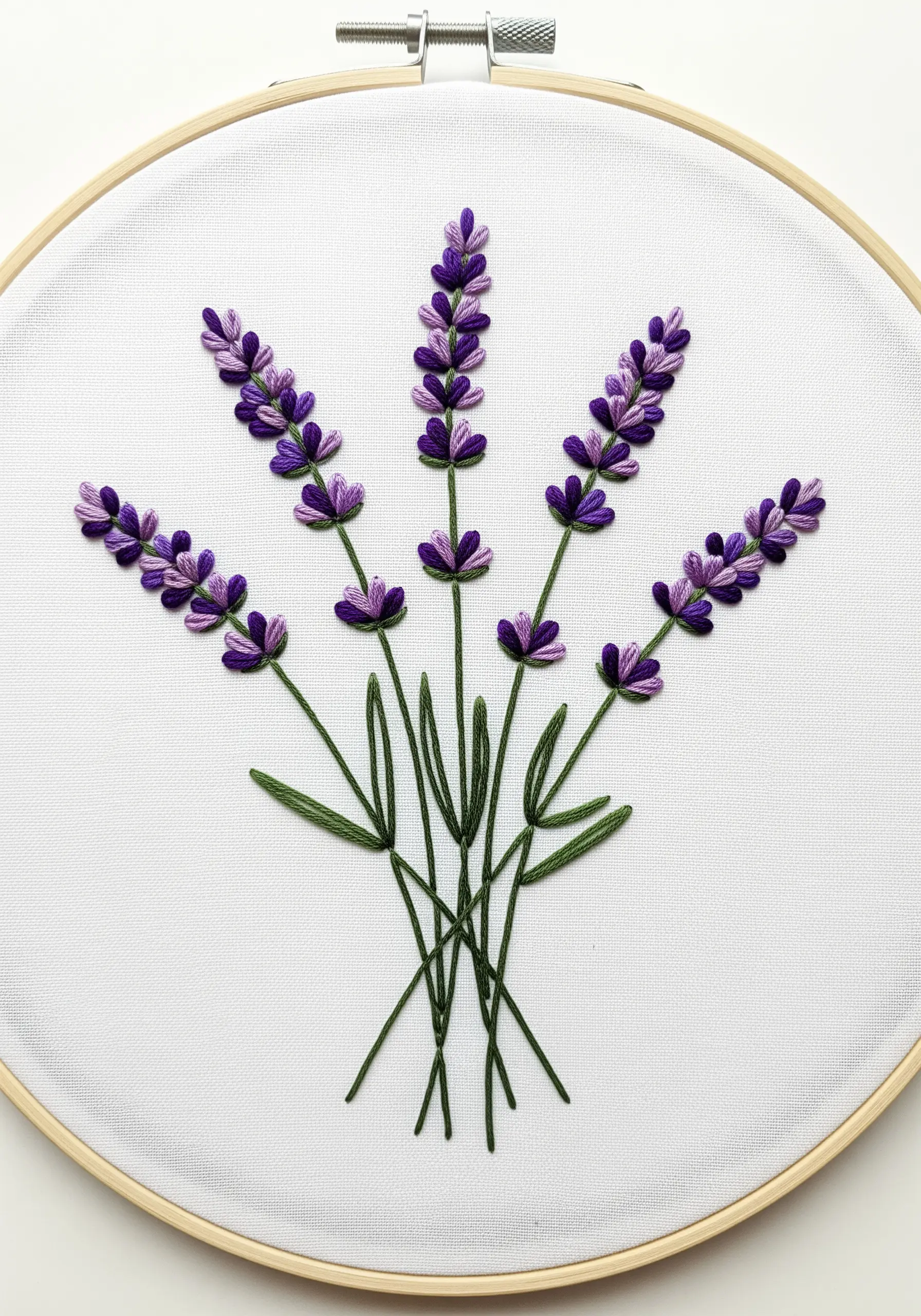 A bouquet of embroidered lavender using purple fishbone stitch and green stem stitch.