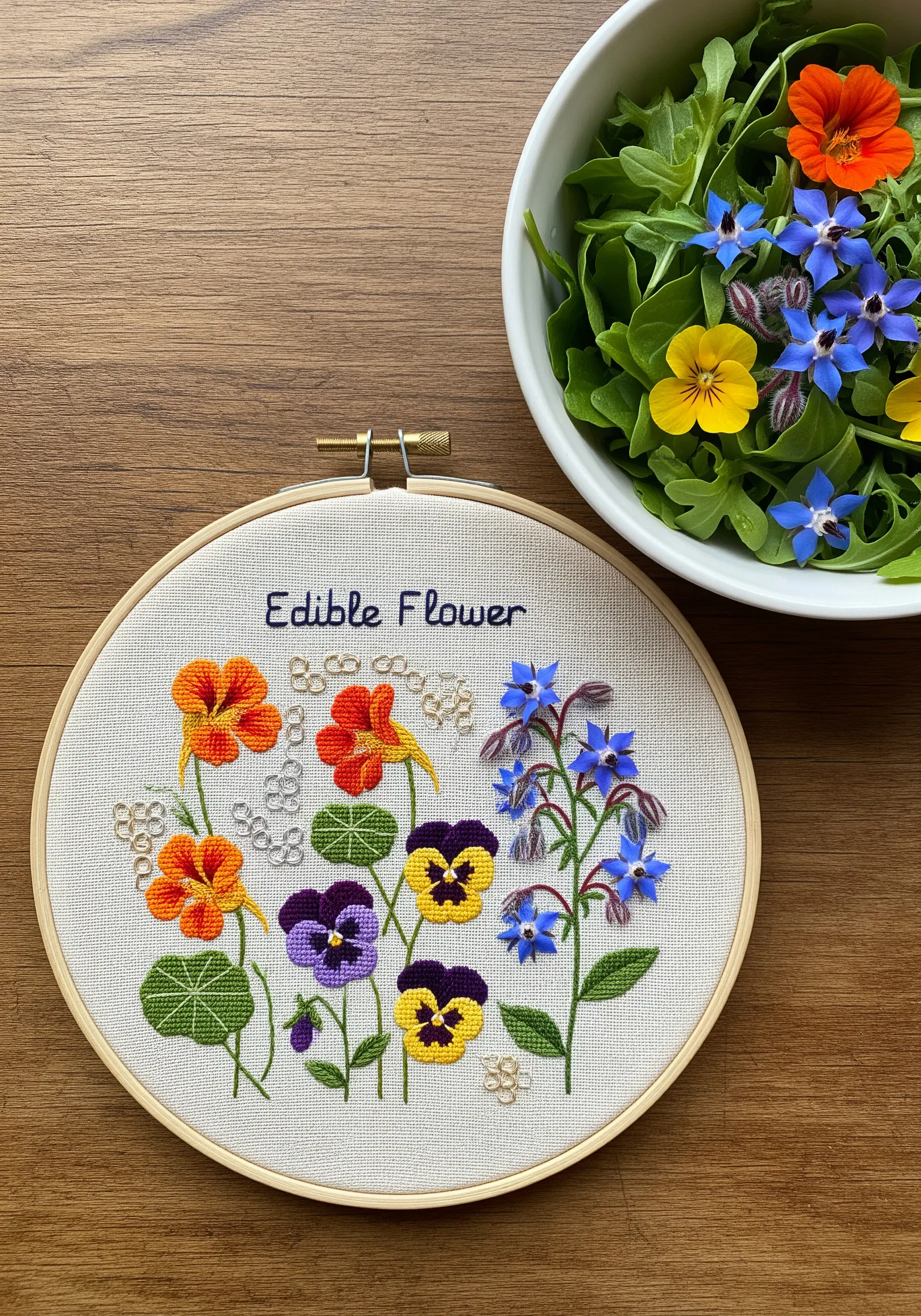 A colorful embroidery hoop of edible flowers like pansies, nasturtiums, and borage.