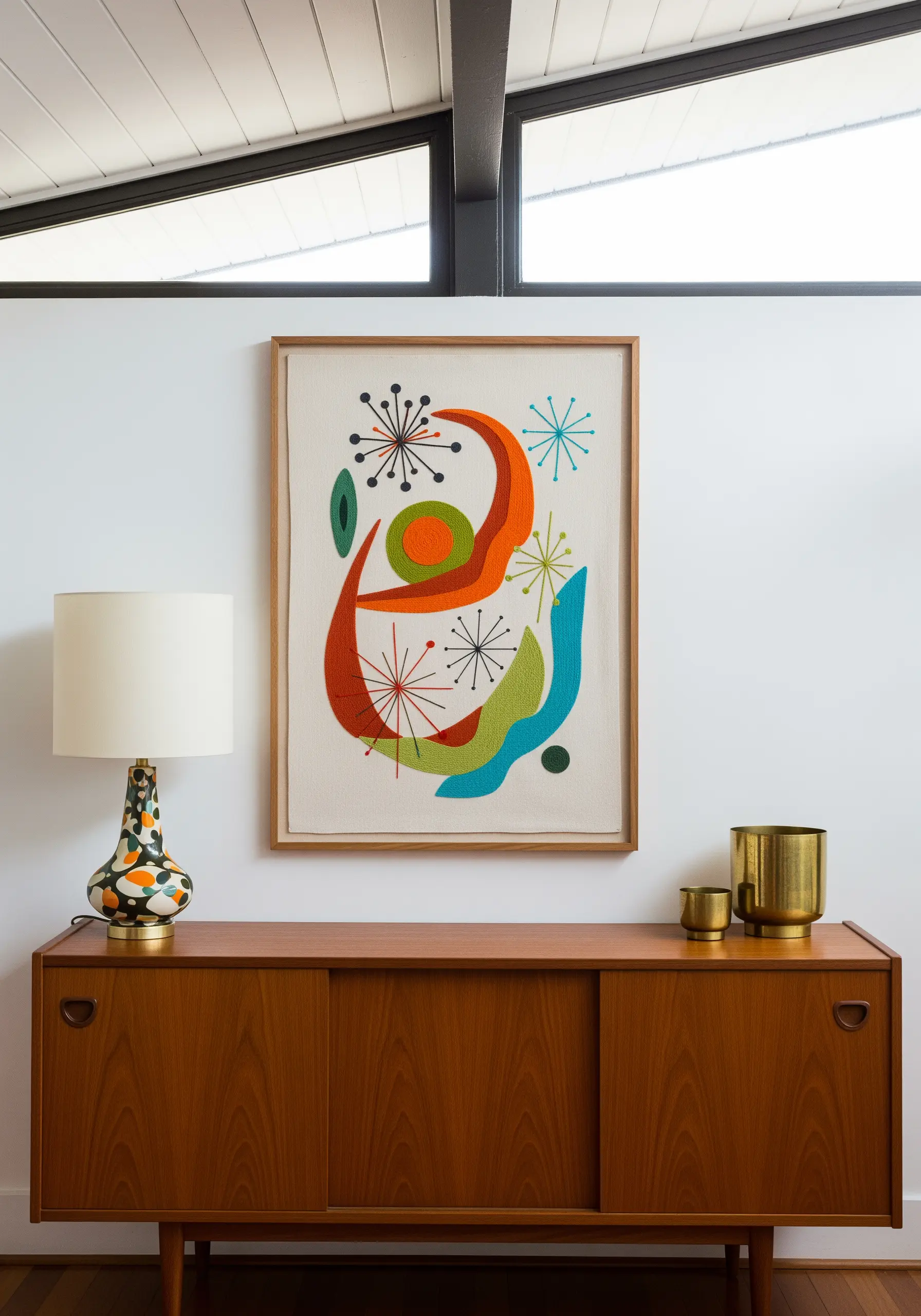 Mid-century modern abstract embroidery with starbursts and bold color blocks.