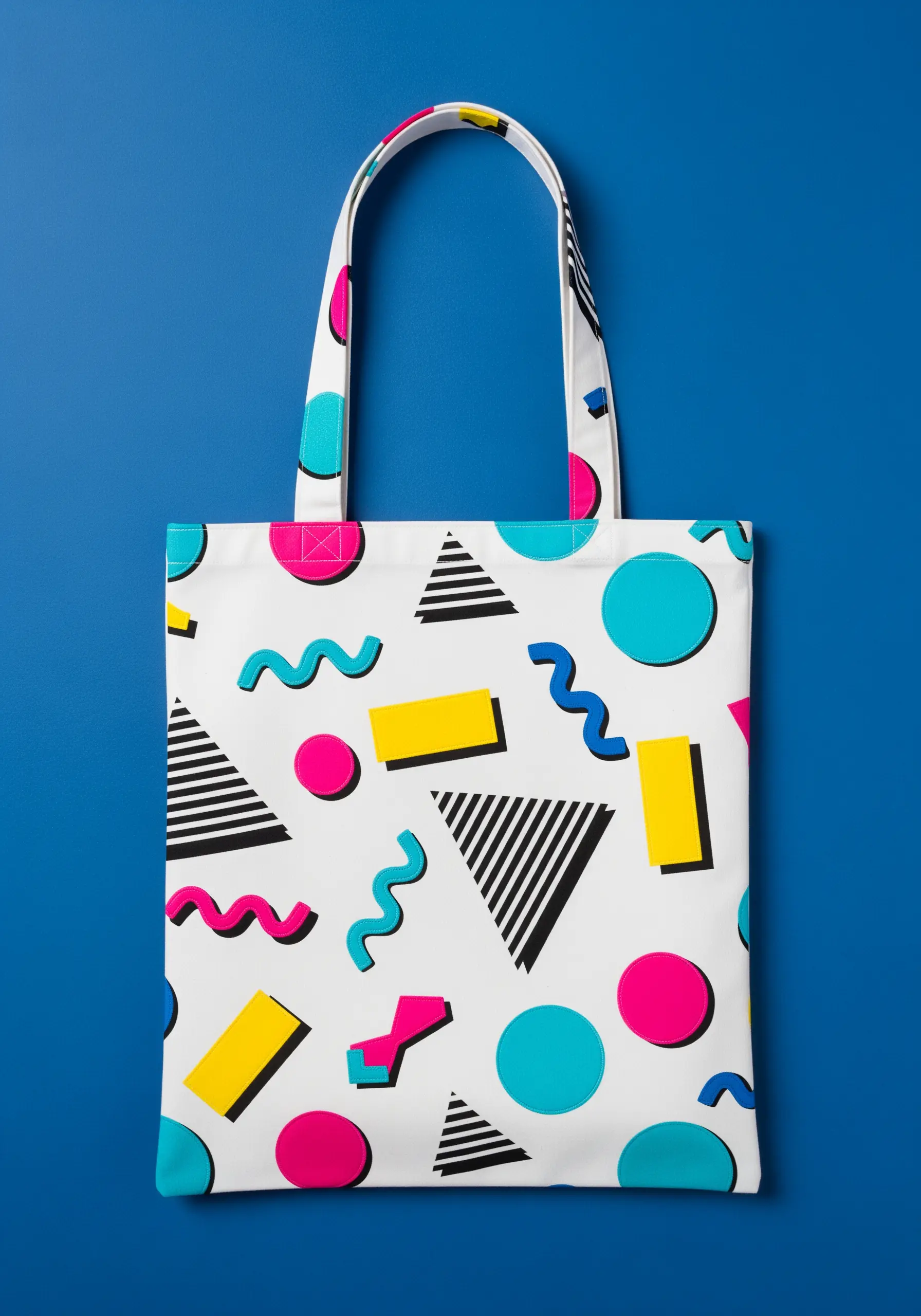 A playful Memphis-style pattern with colorful appliquéd shapes and embroidered squiggles.