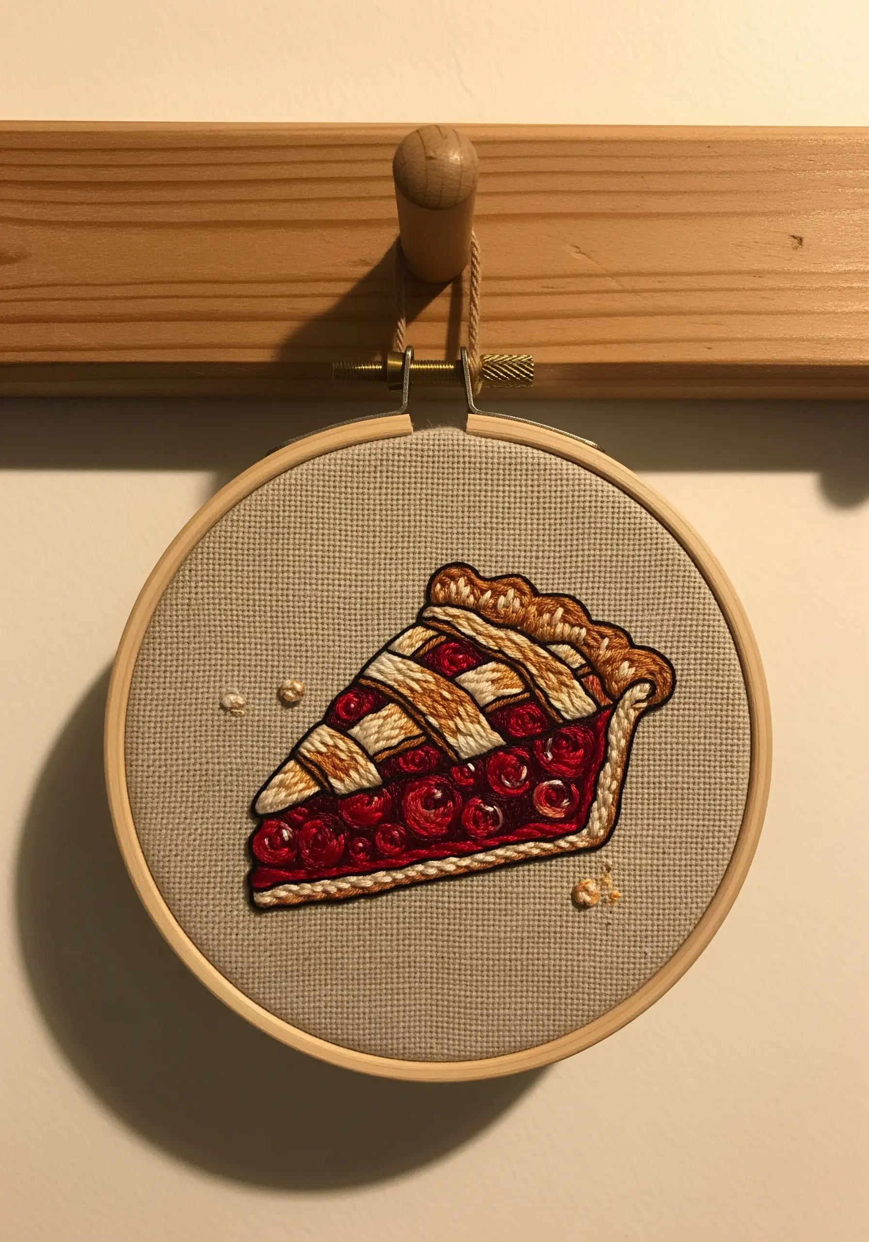 Slice of cherry pie embroidery with woven lattice crust