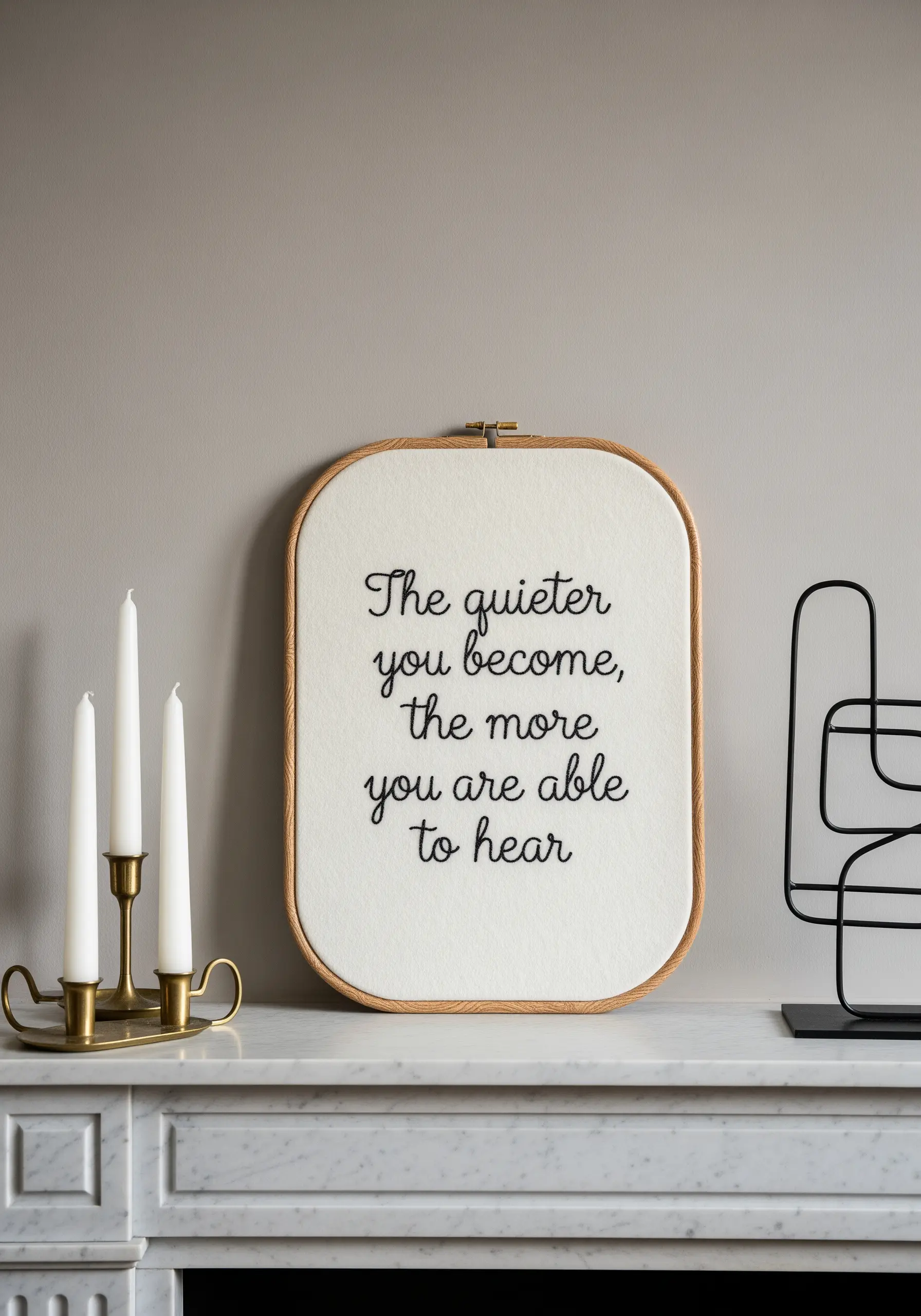 Embroidered quote 'The quieter you become' in black script