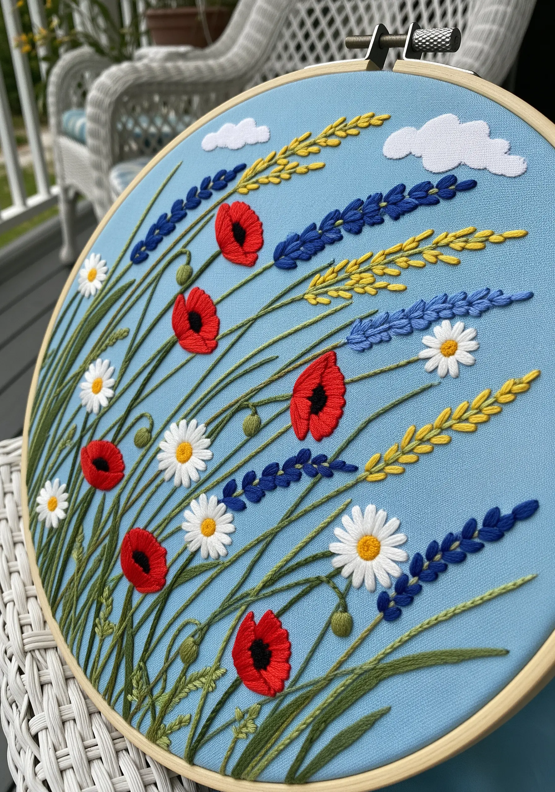 A windswept meadow of poppies, daisies, and lavender, with all stems angled to one side.