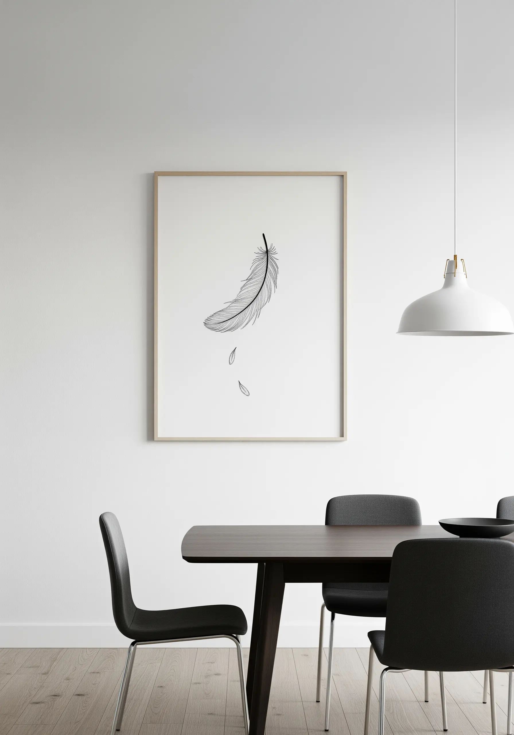 Framed embroidery of a single black feather falling against a white background.