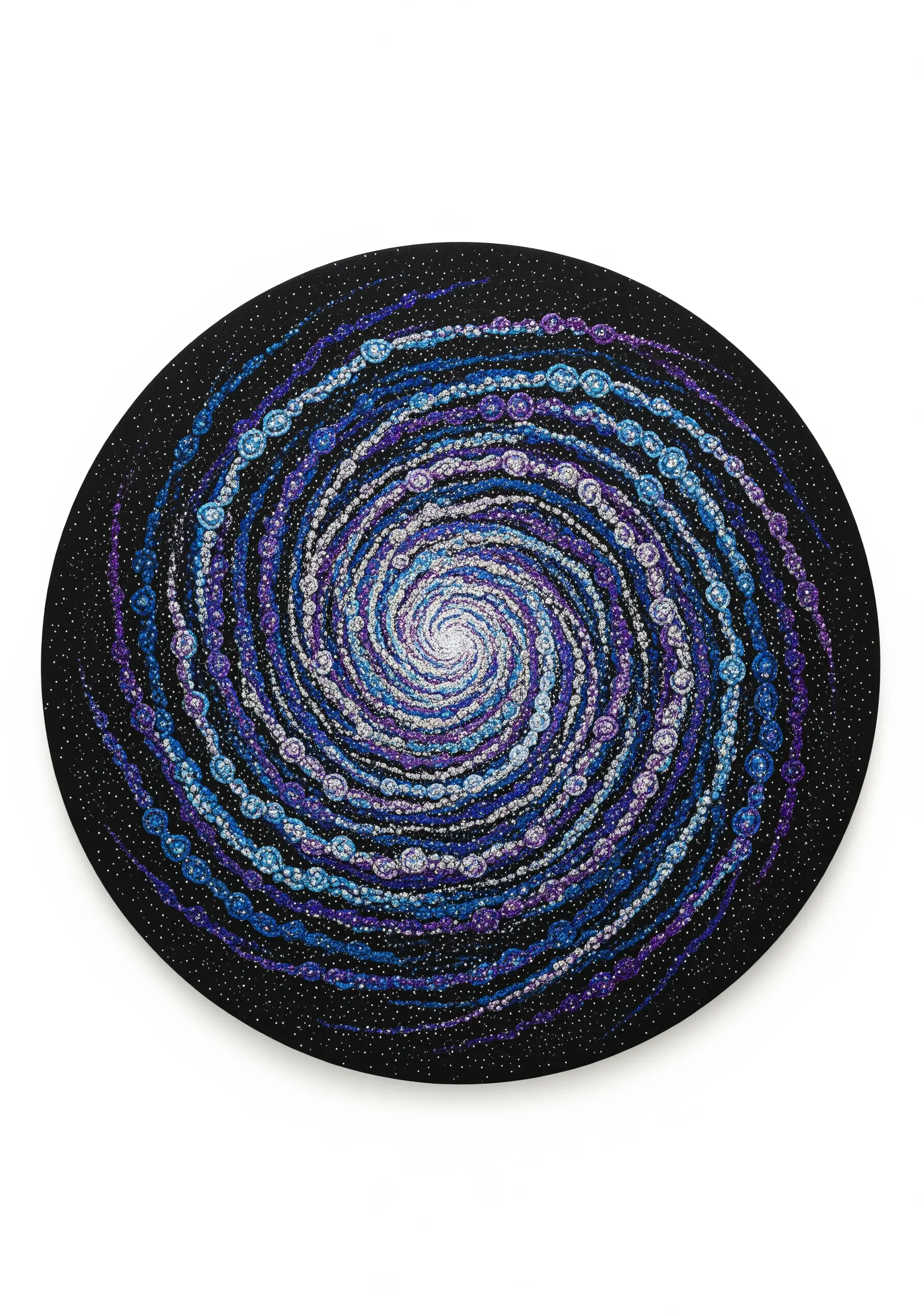 A cosmic spiral galaxy embroidered with blue, purple, and white French knots and beads on black fabric.