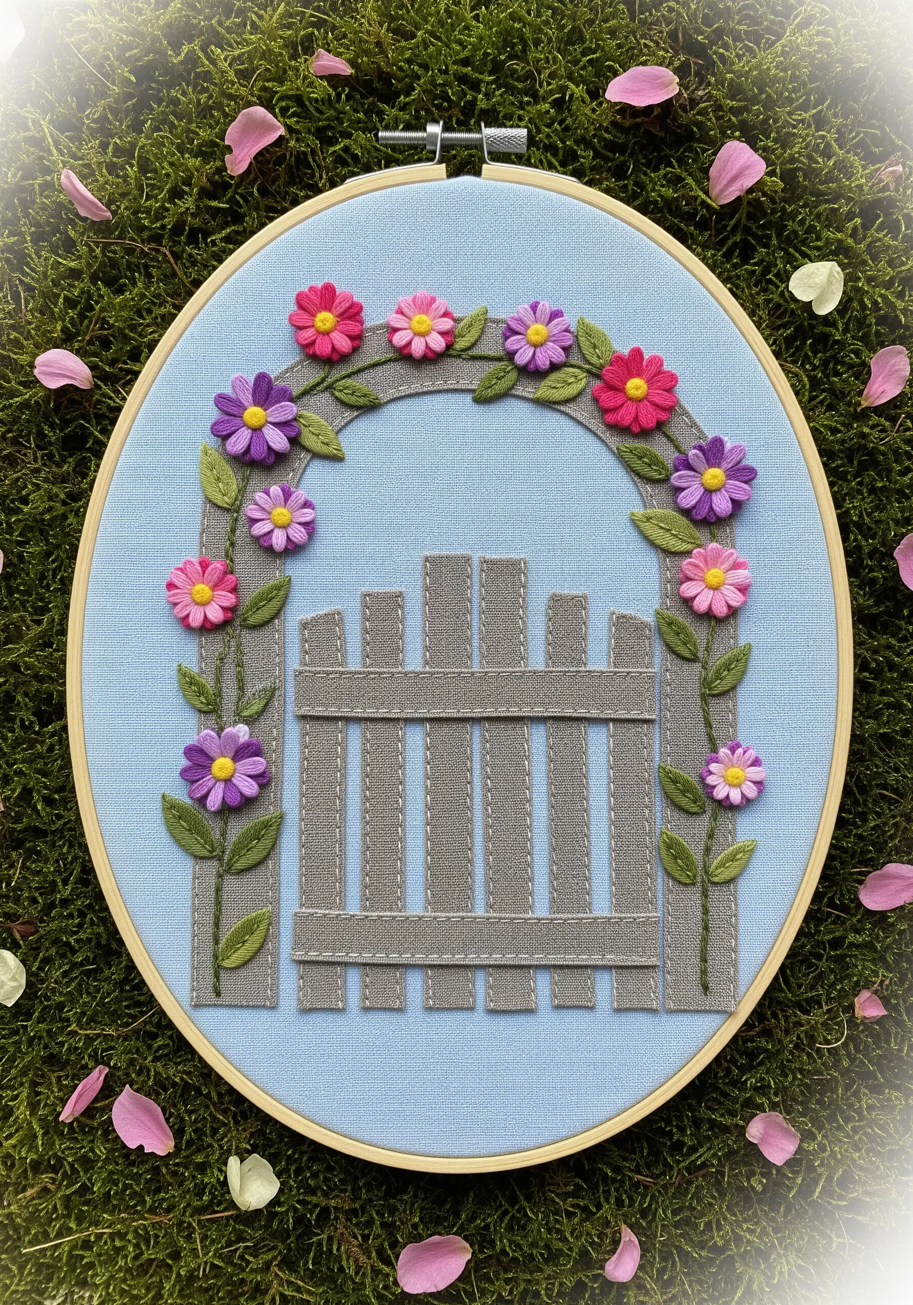 Appliqué garden gate with an arch of dimensional woven wheel flowers.