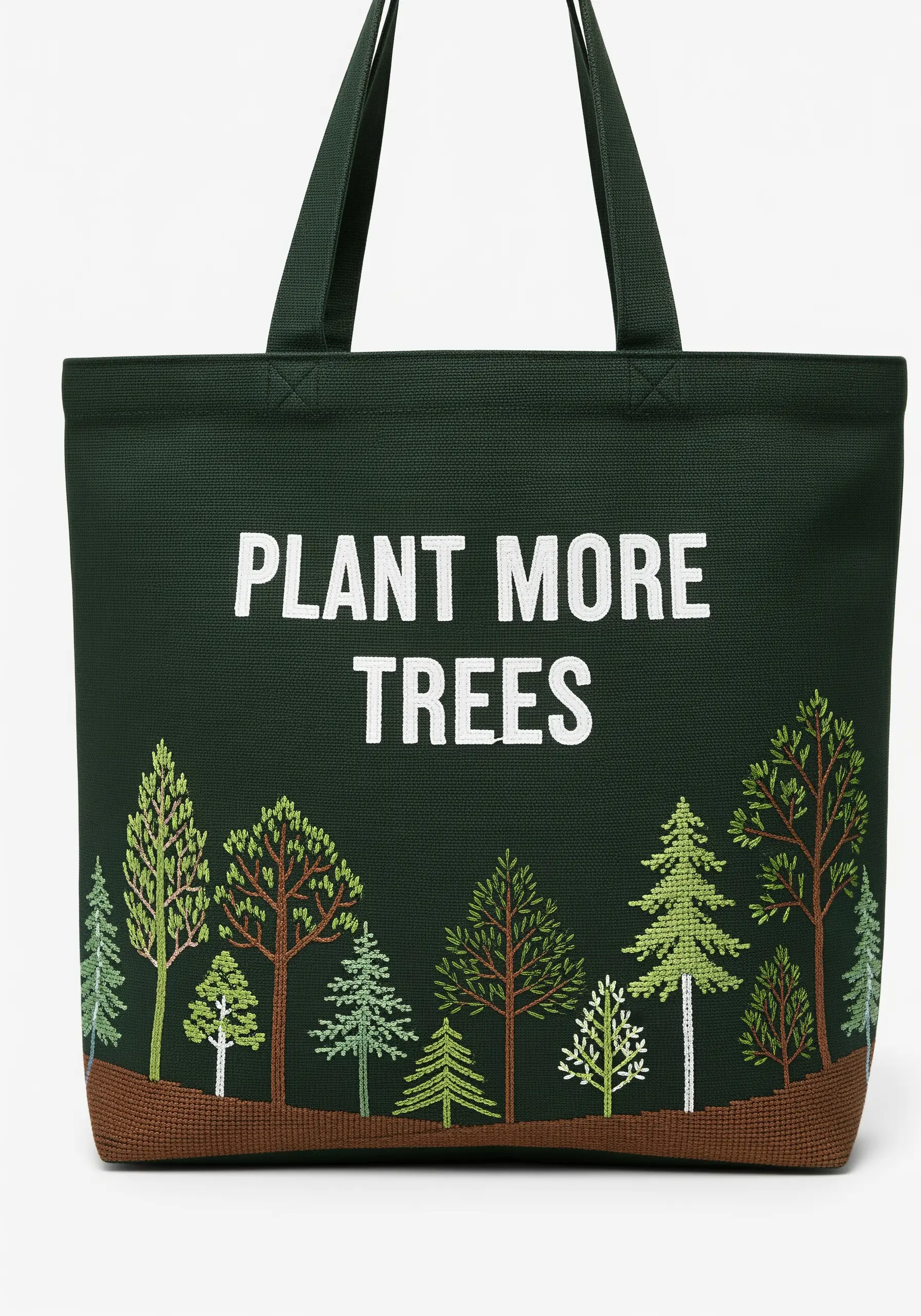 A forest of different embroidered trees above a brown ground on a dark green tote bag.