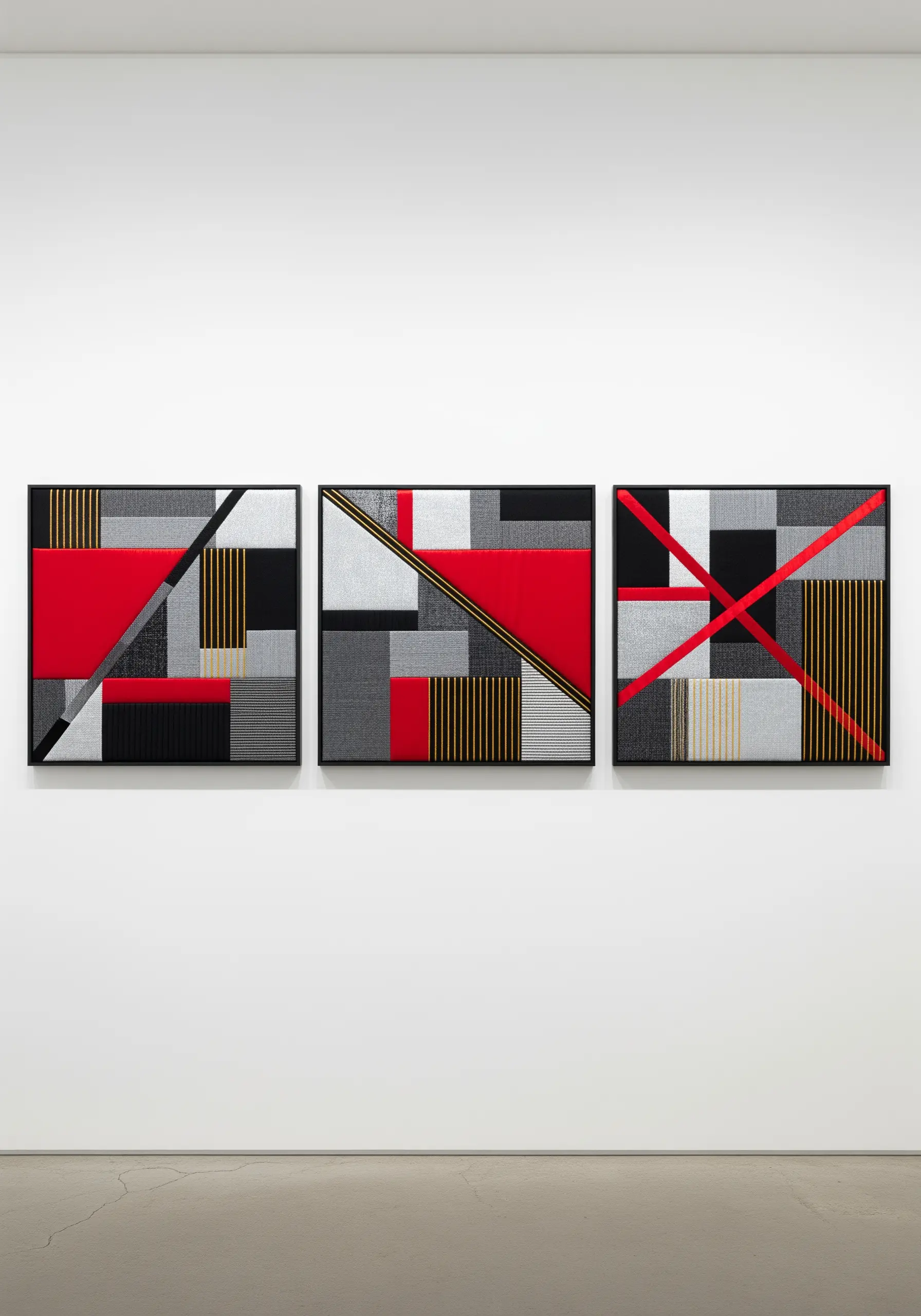 A triptych of abstract geometric art using red, black, and grey fabric with linear stitching.