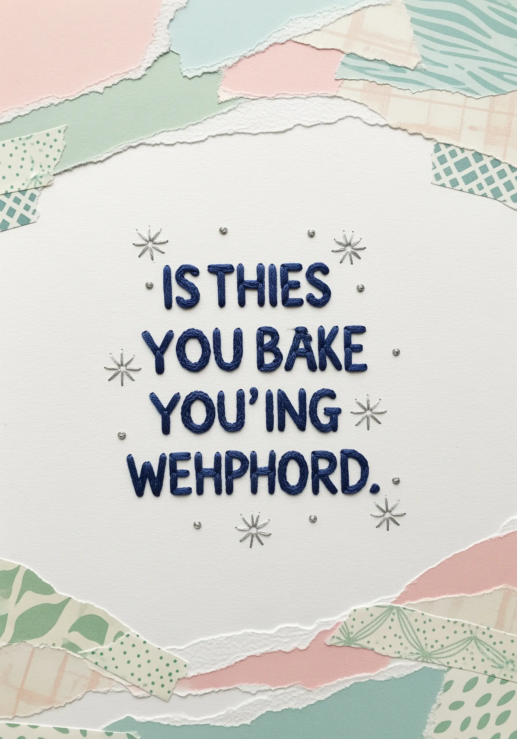 A quote embroidered in raised blue satin stitch on paper with a torn paper border.