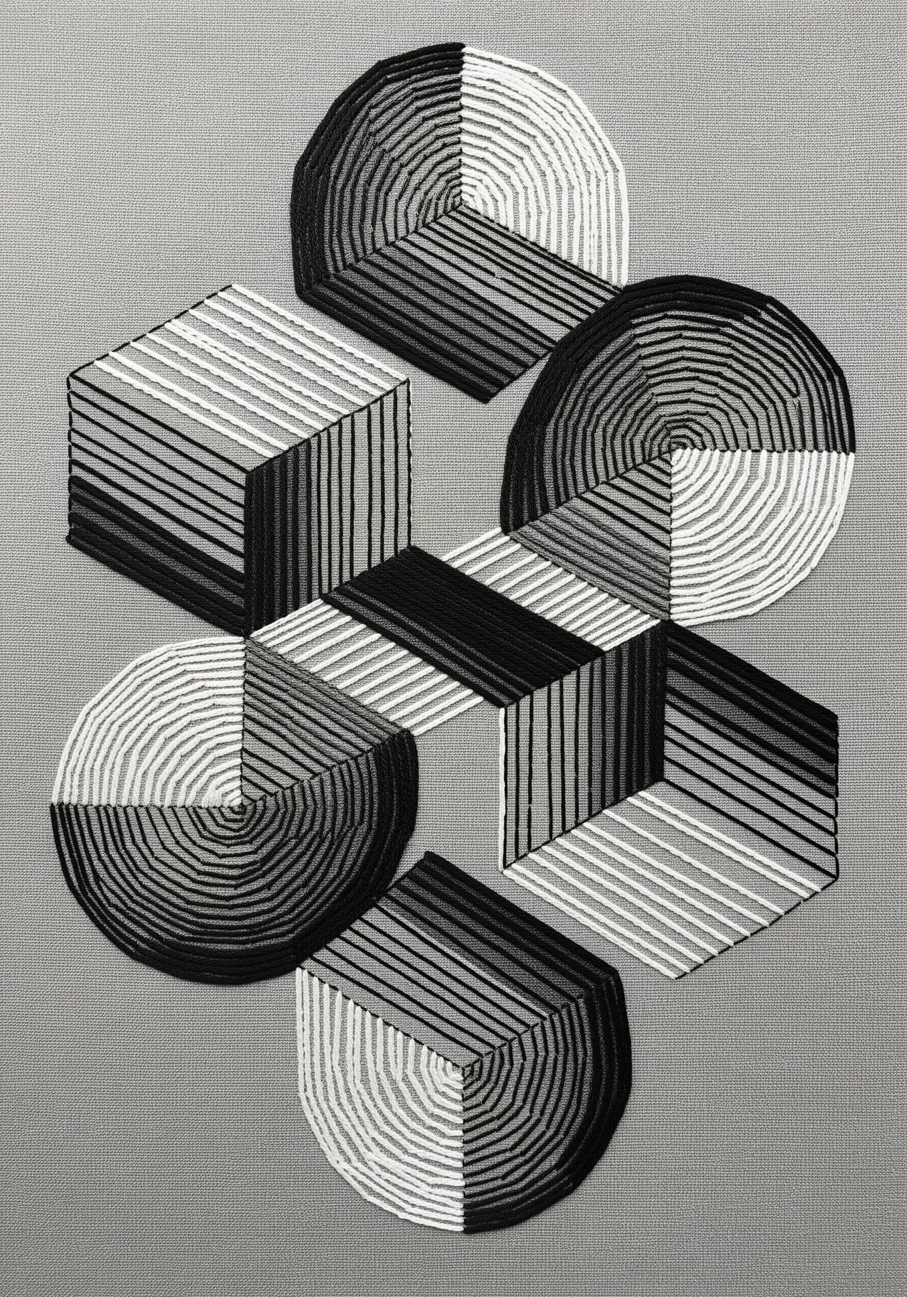Abstract geometric shapes in black and white satin stitch creating an optical illusion.