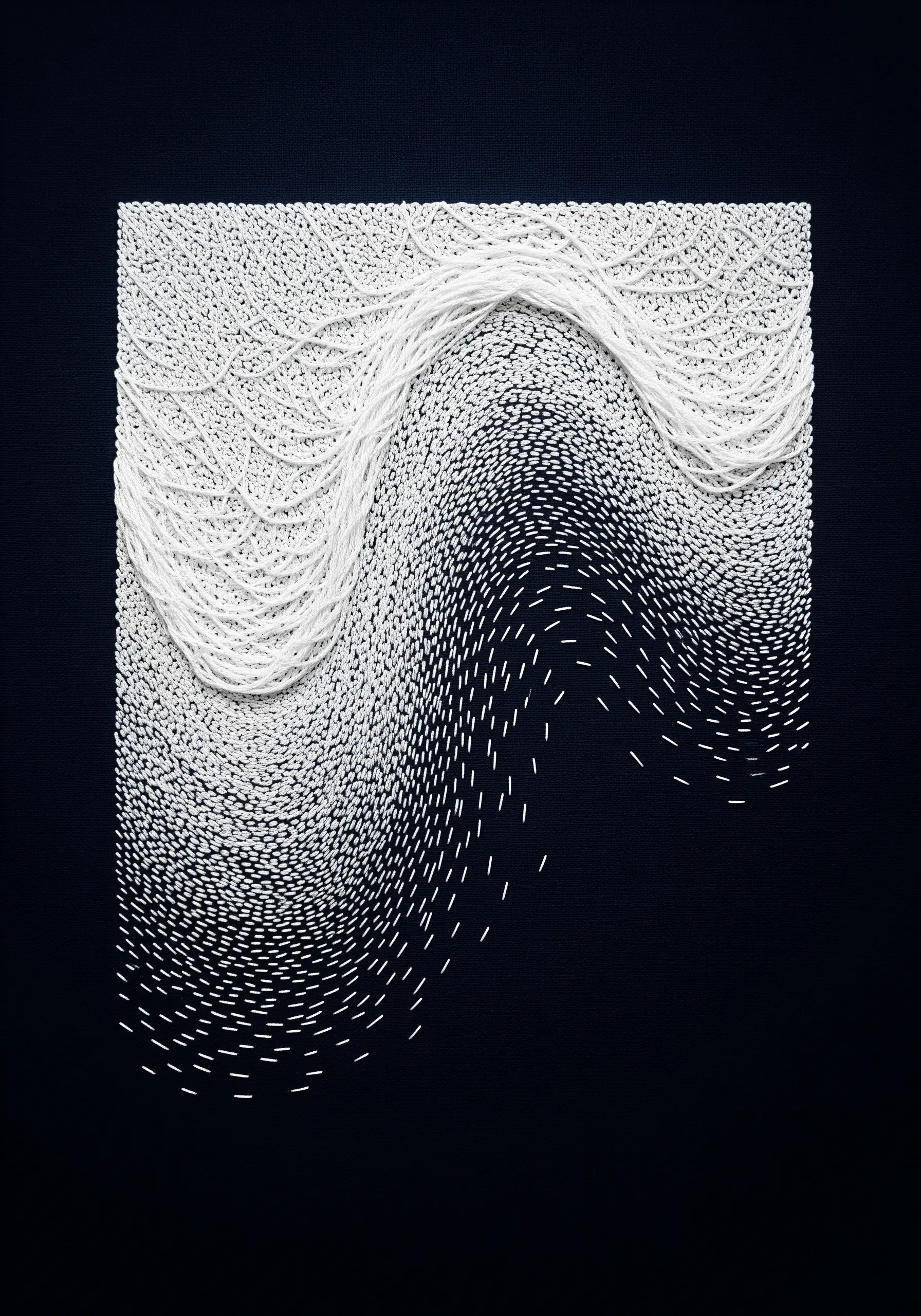 An abstract wave of white thread dissolving into scattered stitches on black fabric.