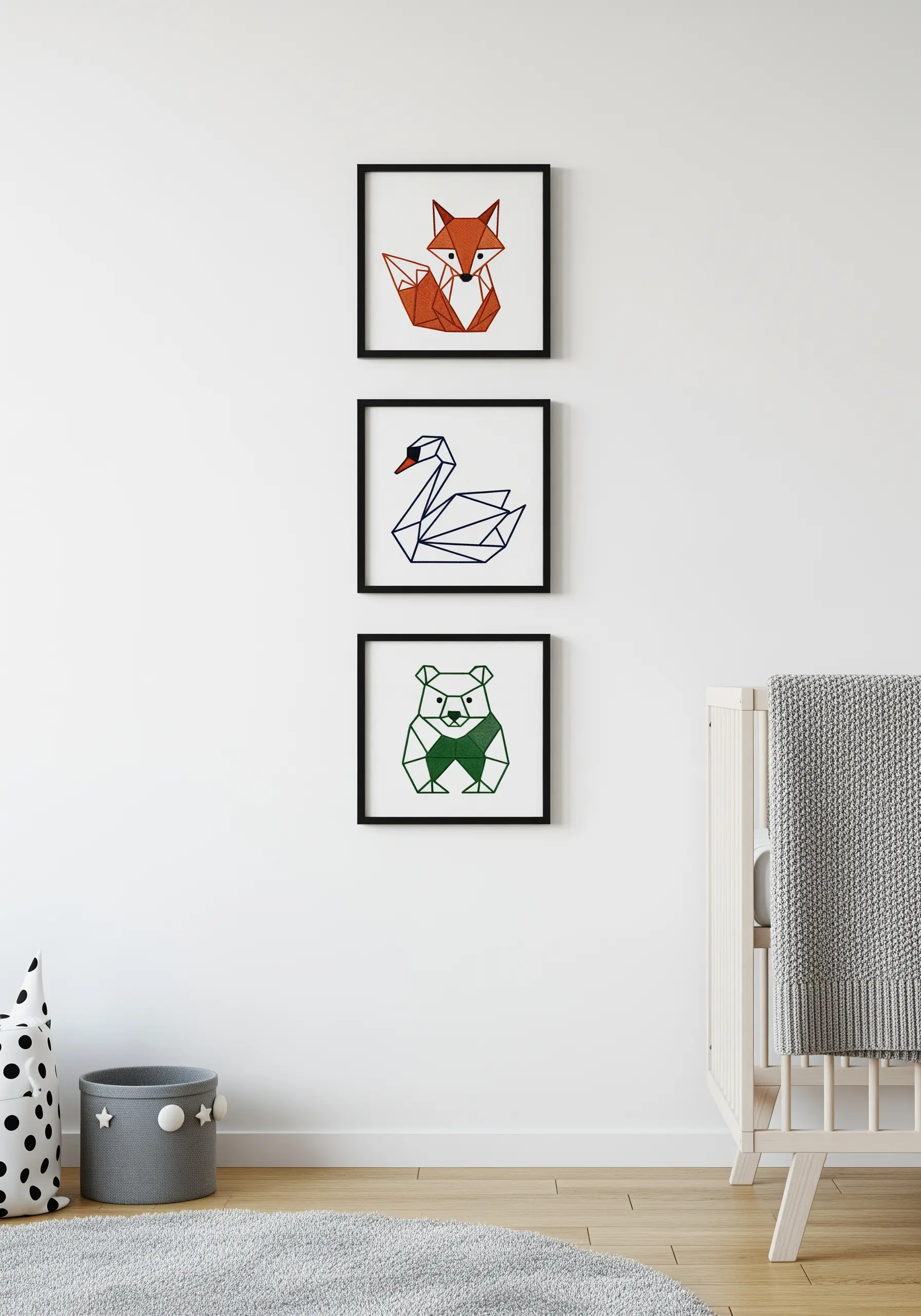 Framed geometric embroideries of a fox, swan, and bear in bold colors.