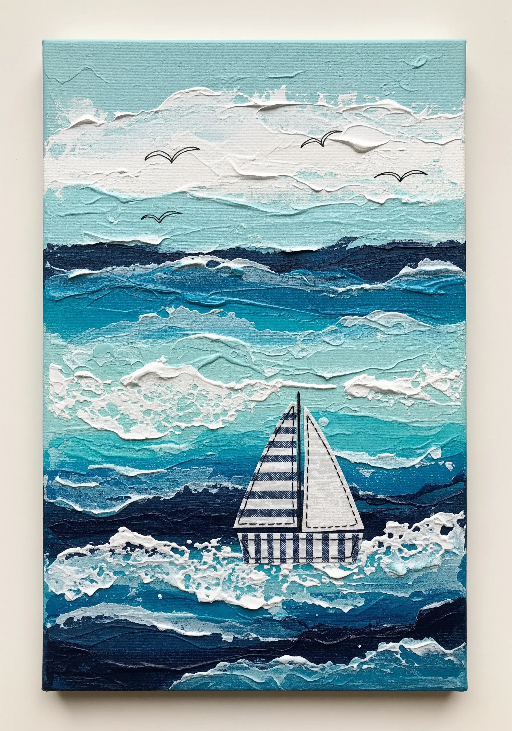 A mixed-media seascape with a paper sailboat defined by backstitch on a textured painted canvas.