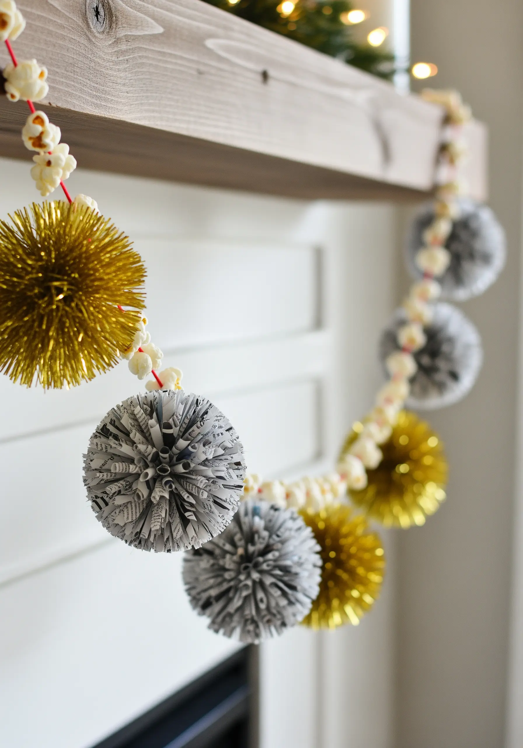 Garland made of popcorn and metallic gold and silver pom-poms