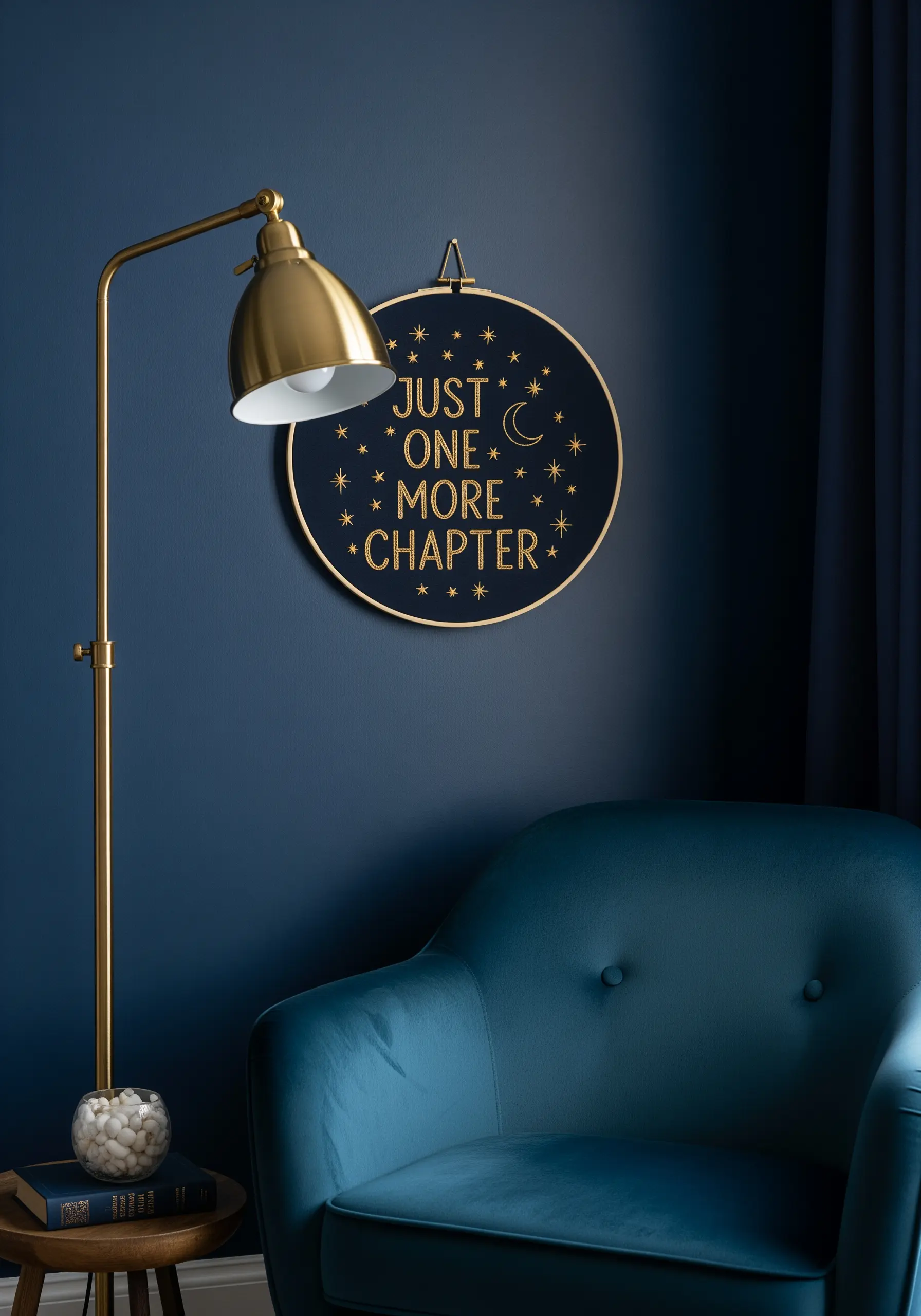 Gold metallic thread embroidered on dark navy fabric, creating a celestial-themed quote.