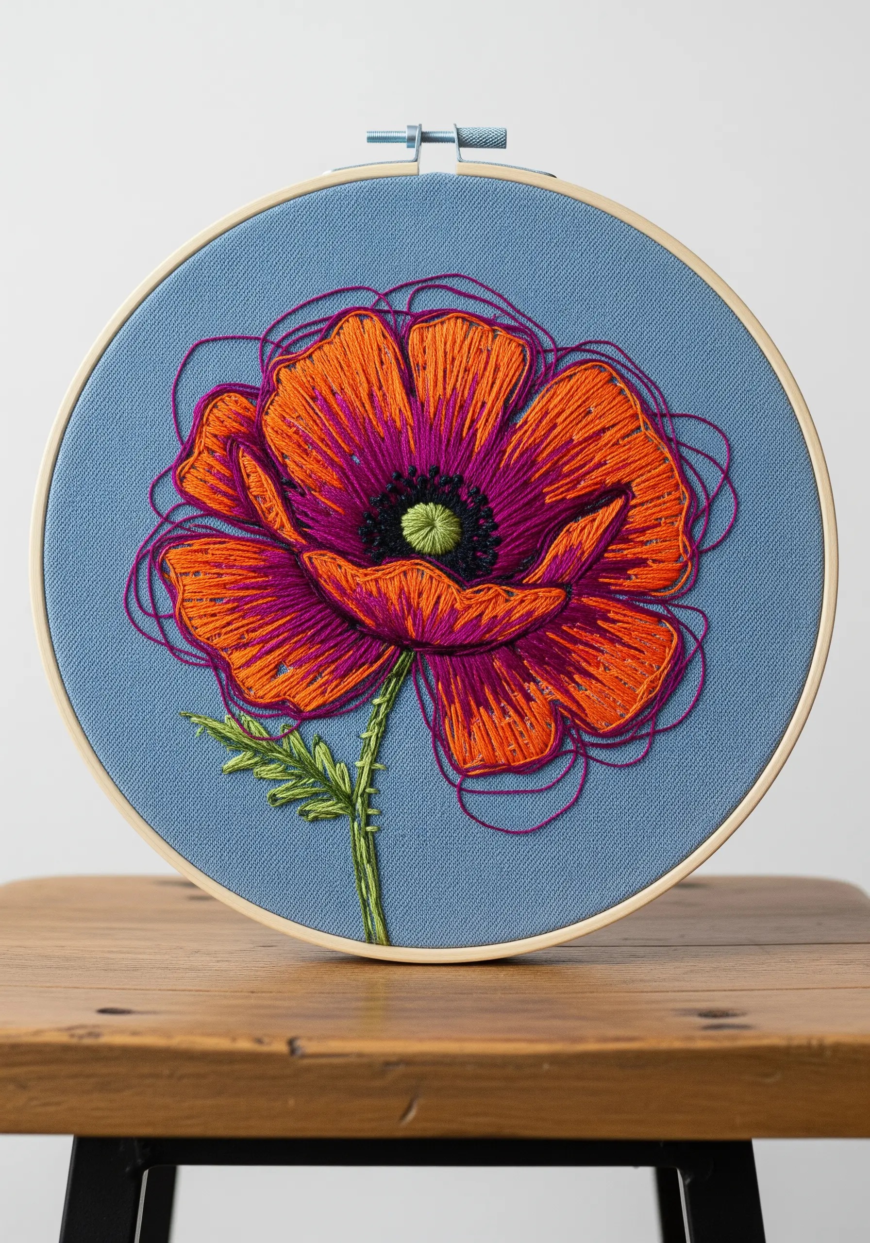Sketch-style poppy flower embroidery with vibrant colors