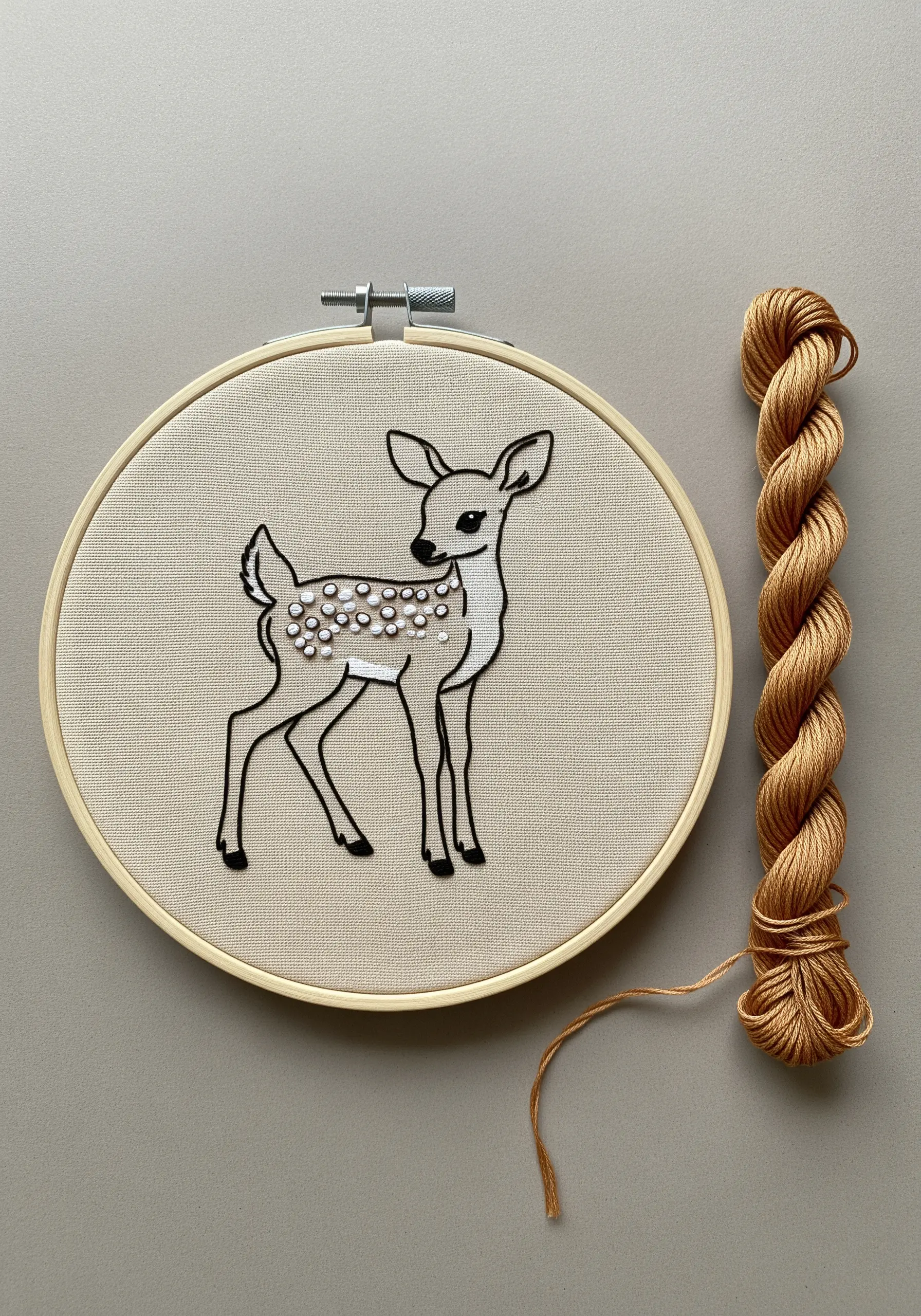 Deer fawn embroidery with French knot spots and black outline