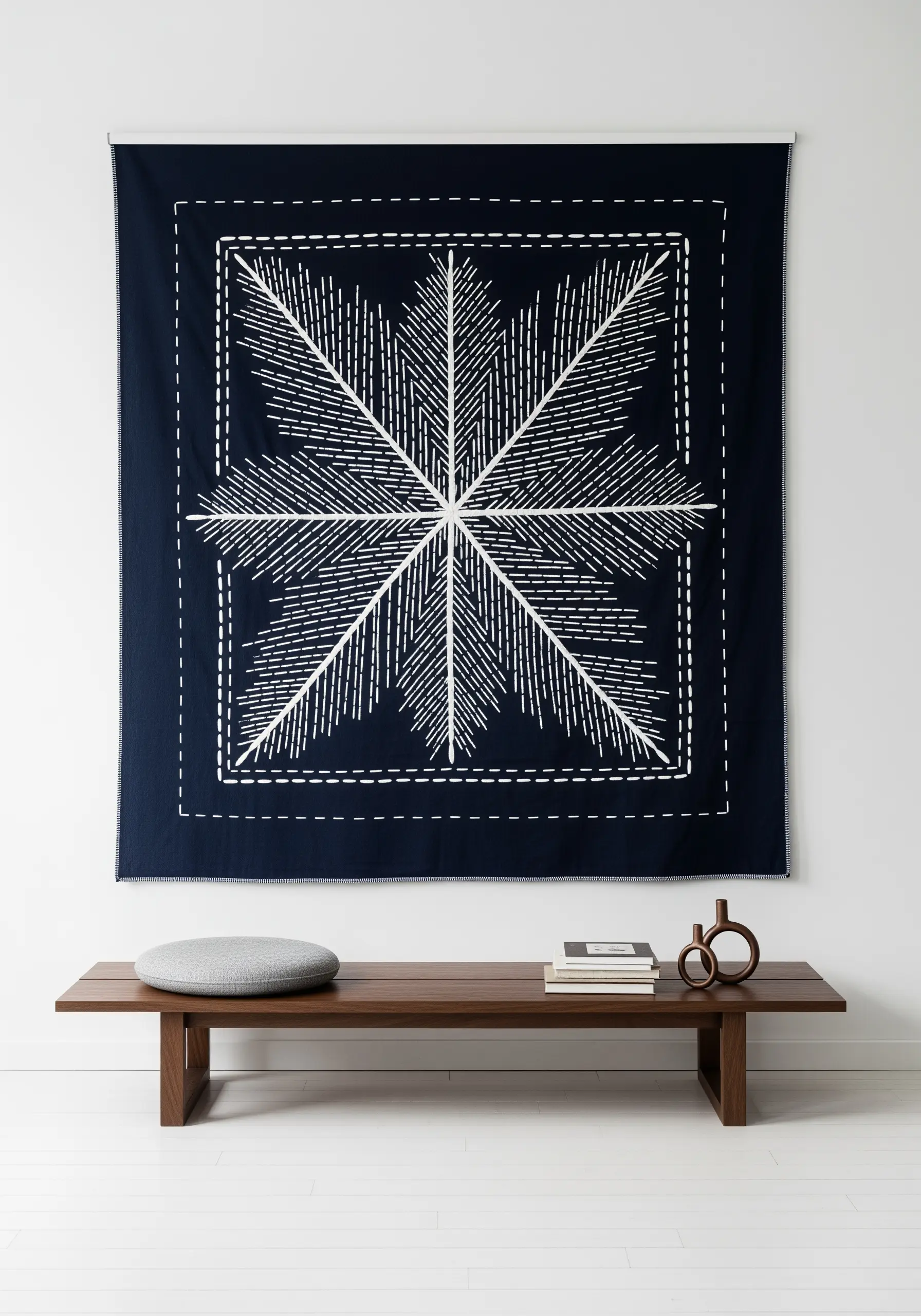 A large, dark blue tapestry with a white Sashiko-style stitched geometric star pattern.