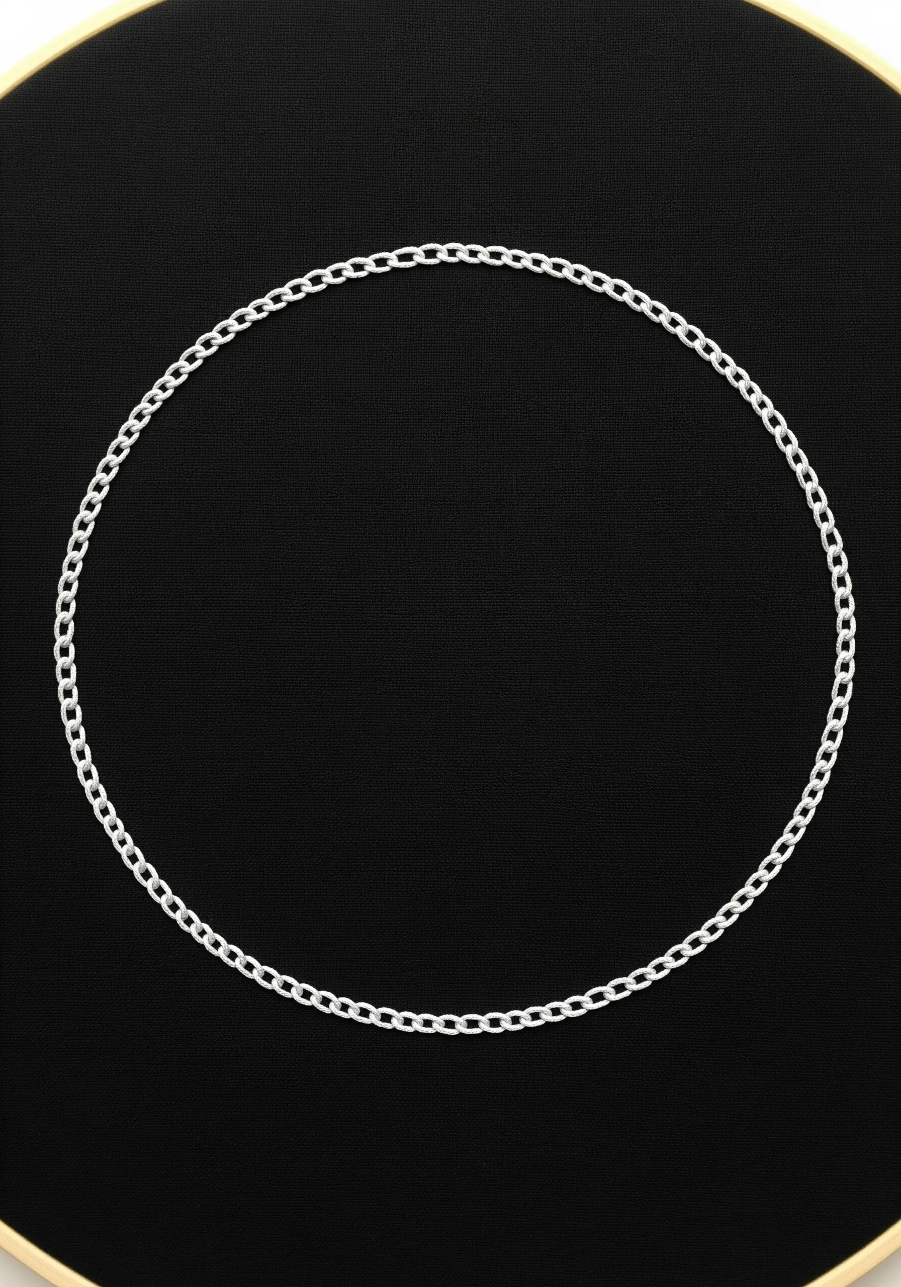 A single circle of white chain stitch on a black fabric background in a hoop.