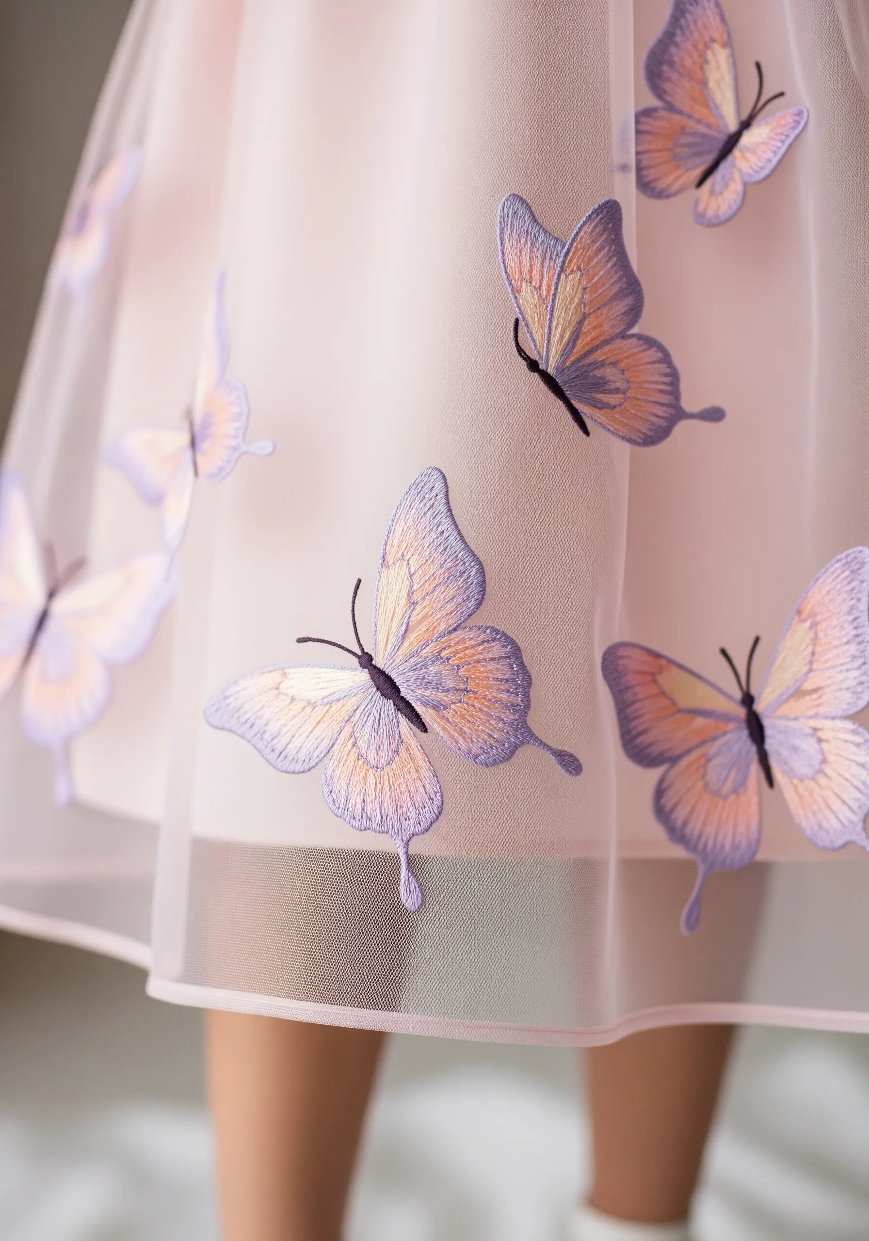 Pink tulle dress with purple and orange embroidered butterflies