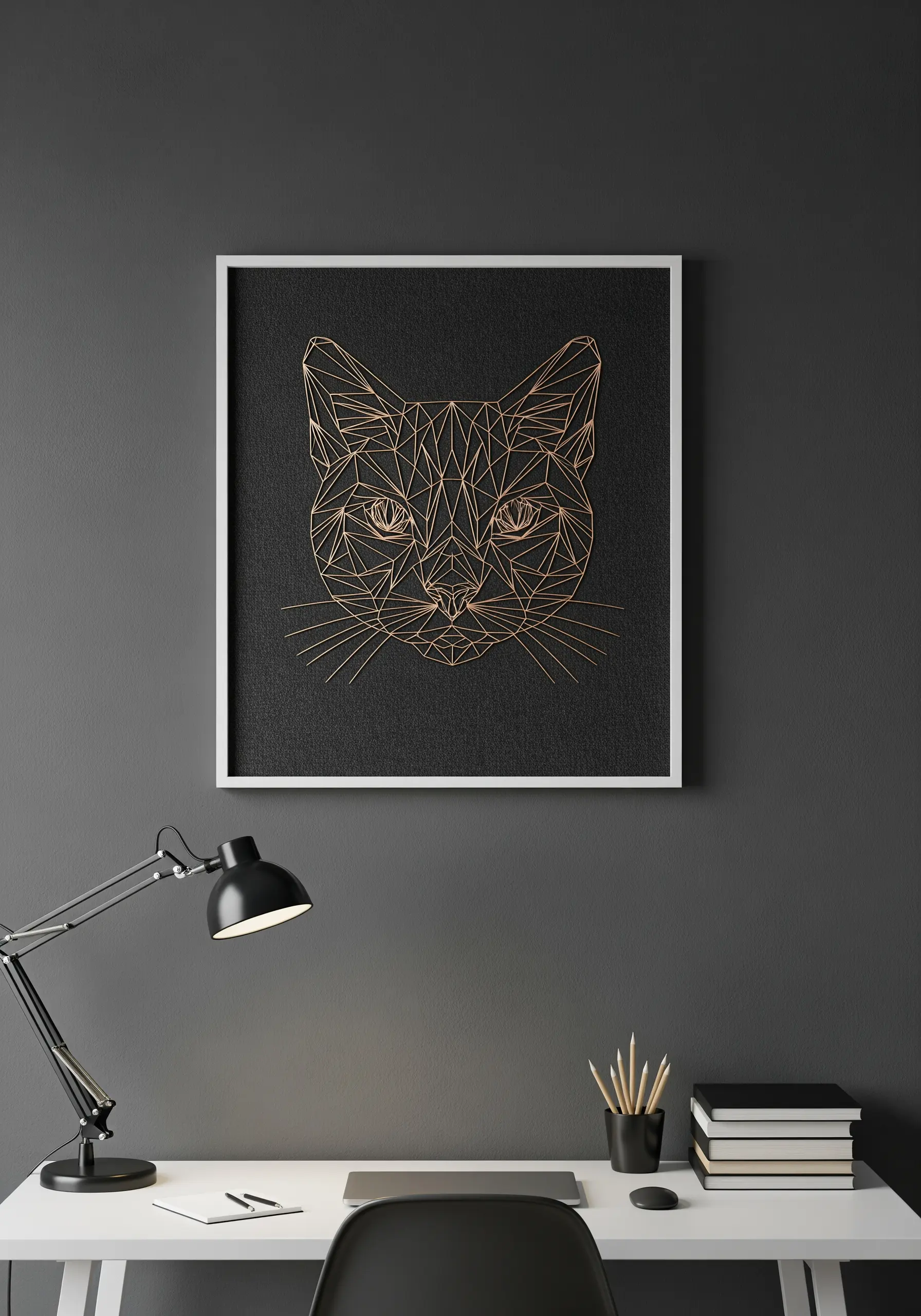 Geometric cat face embroidery using copper thread on black canvas