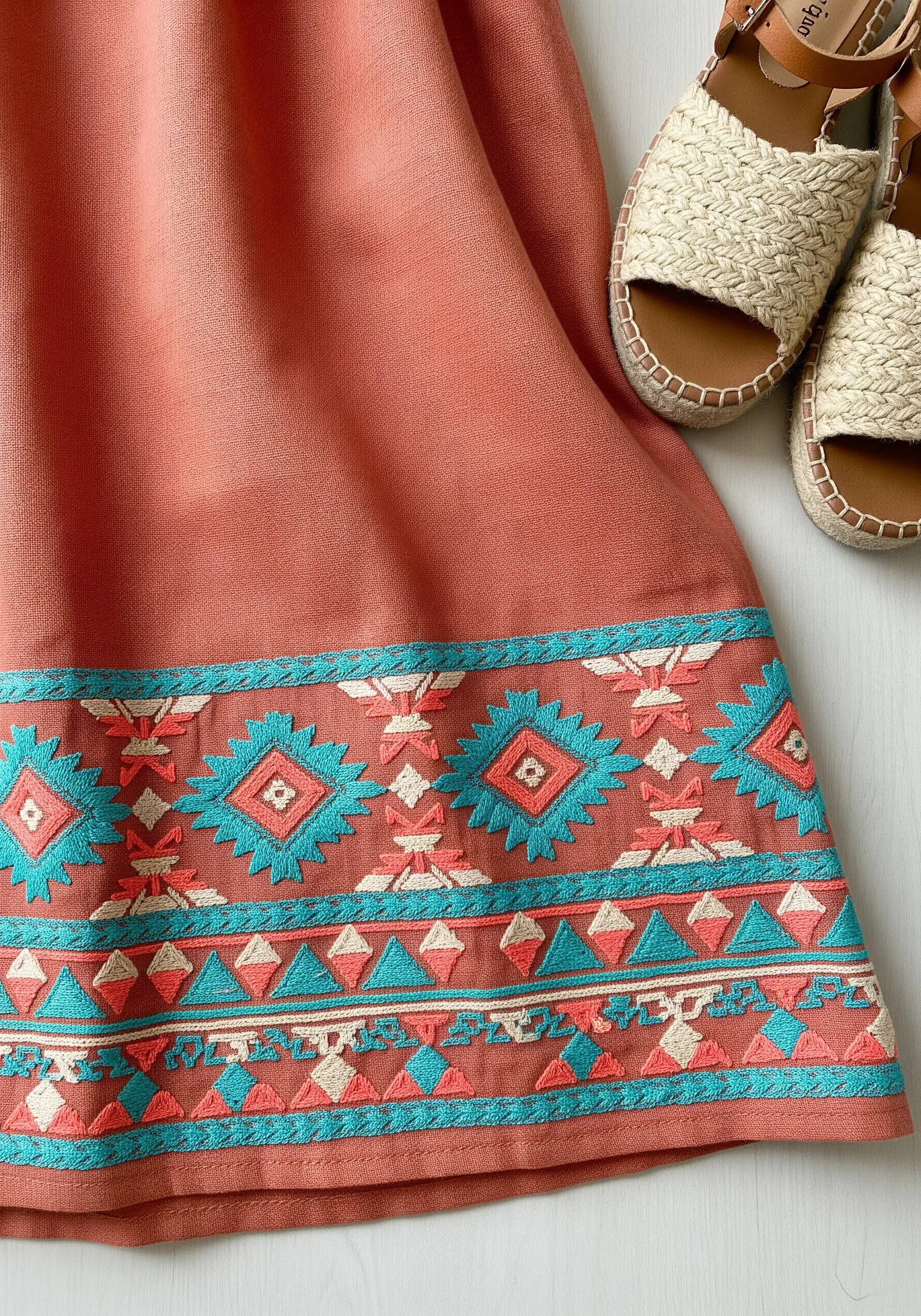 Terracotta skirt with turquoise and coral geometric Aztec embroidery