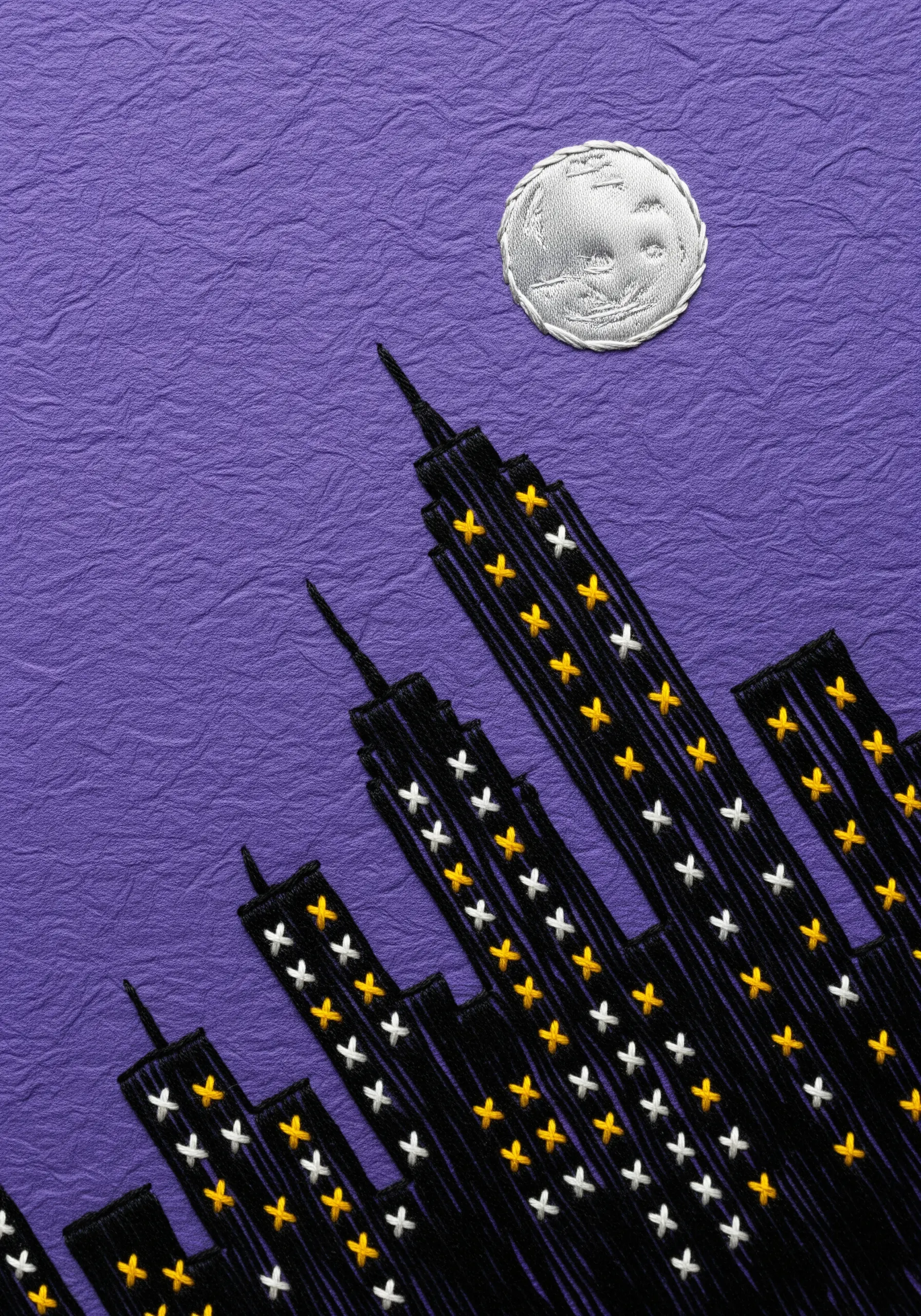 Embroidered cityscape silhouette on purple paper with cross-stitch windows.