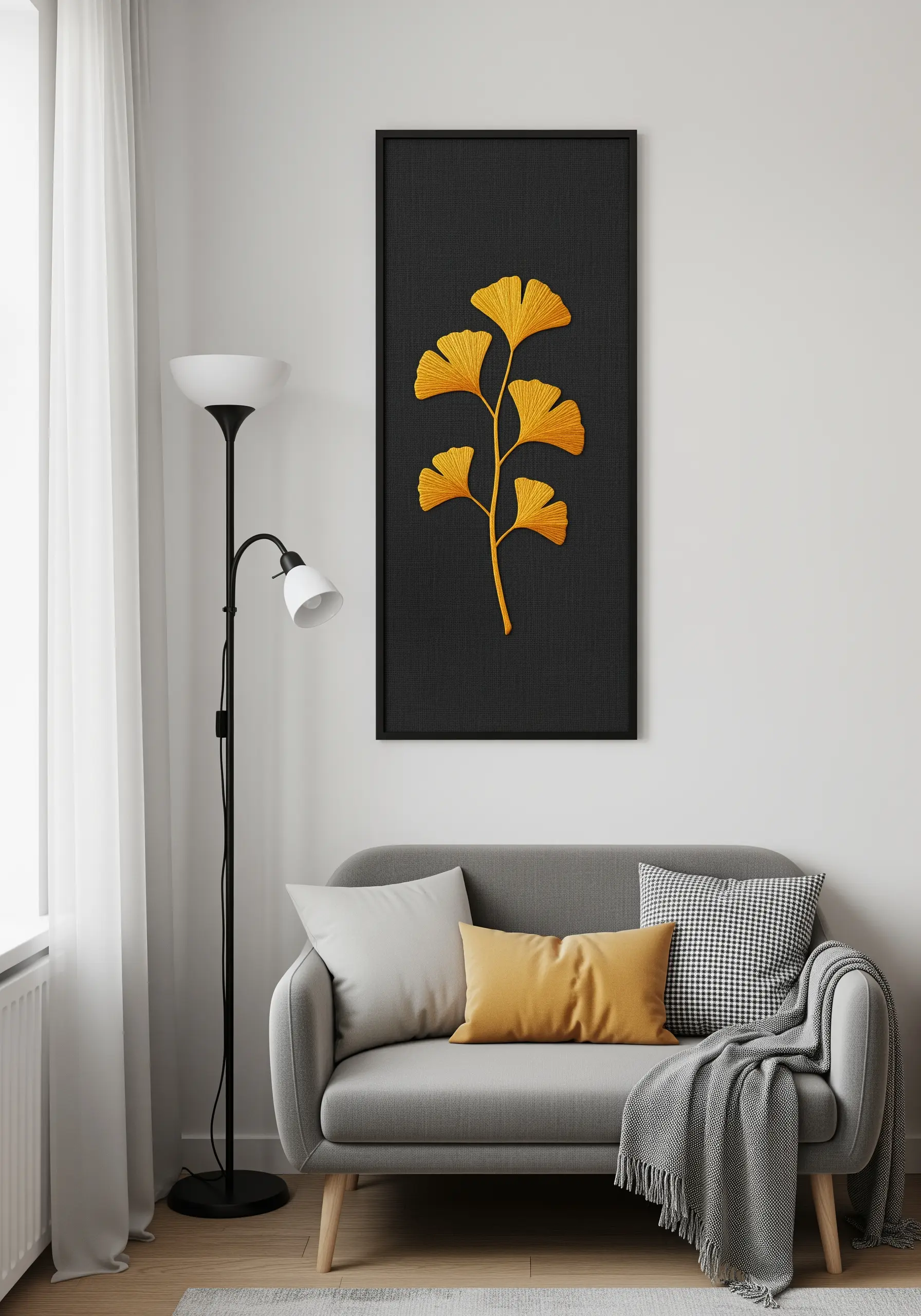 Golden ginkgo leaves embroidered with satin stitch on black fabric.