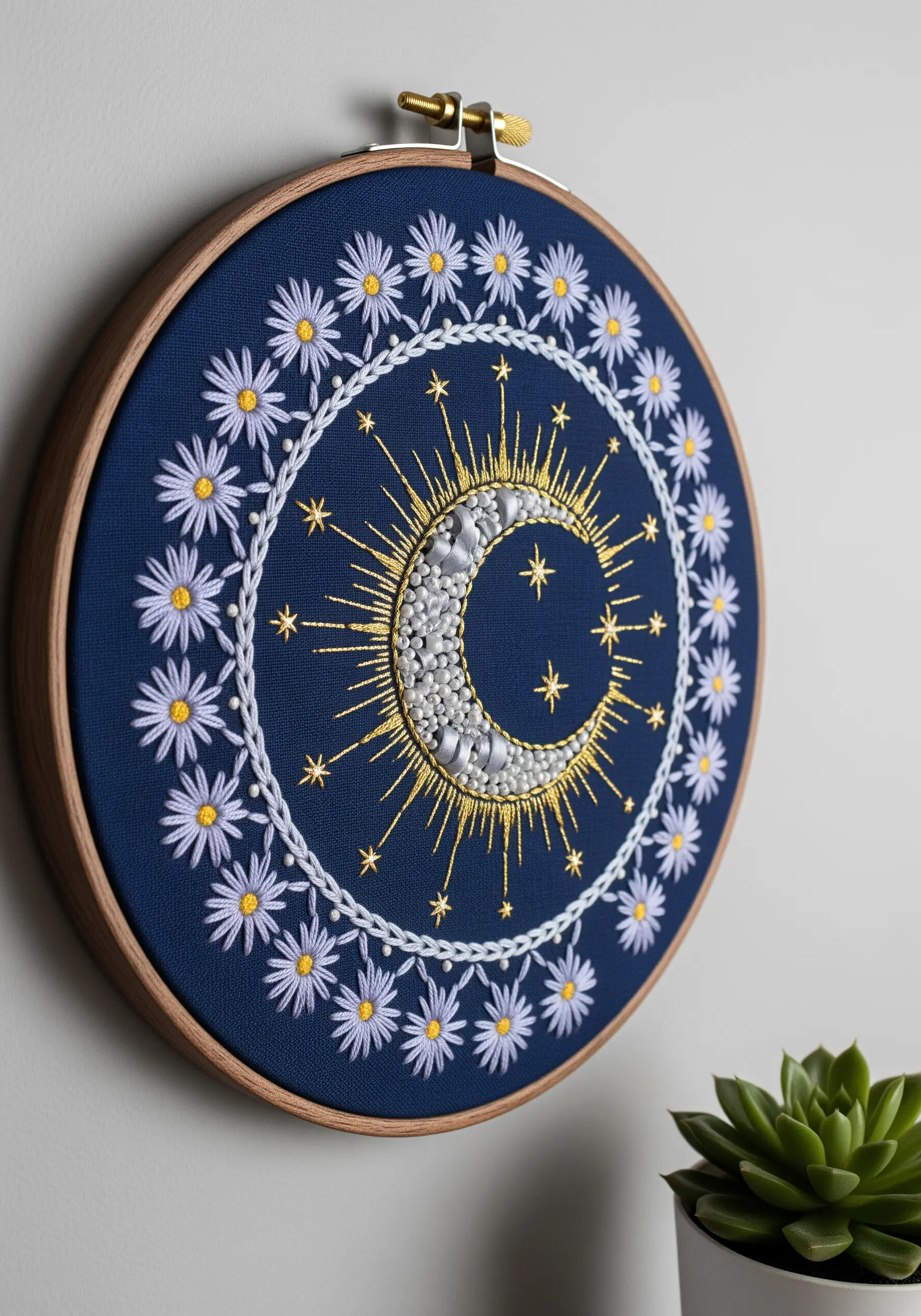 Celestial moon mandala with silver beads, metallic thread, and lavender daisies on navy blue fabric.