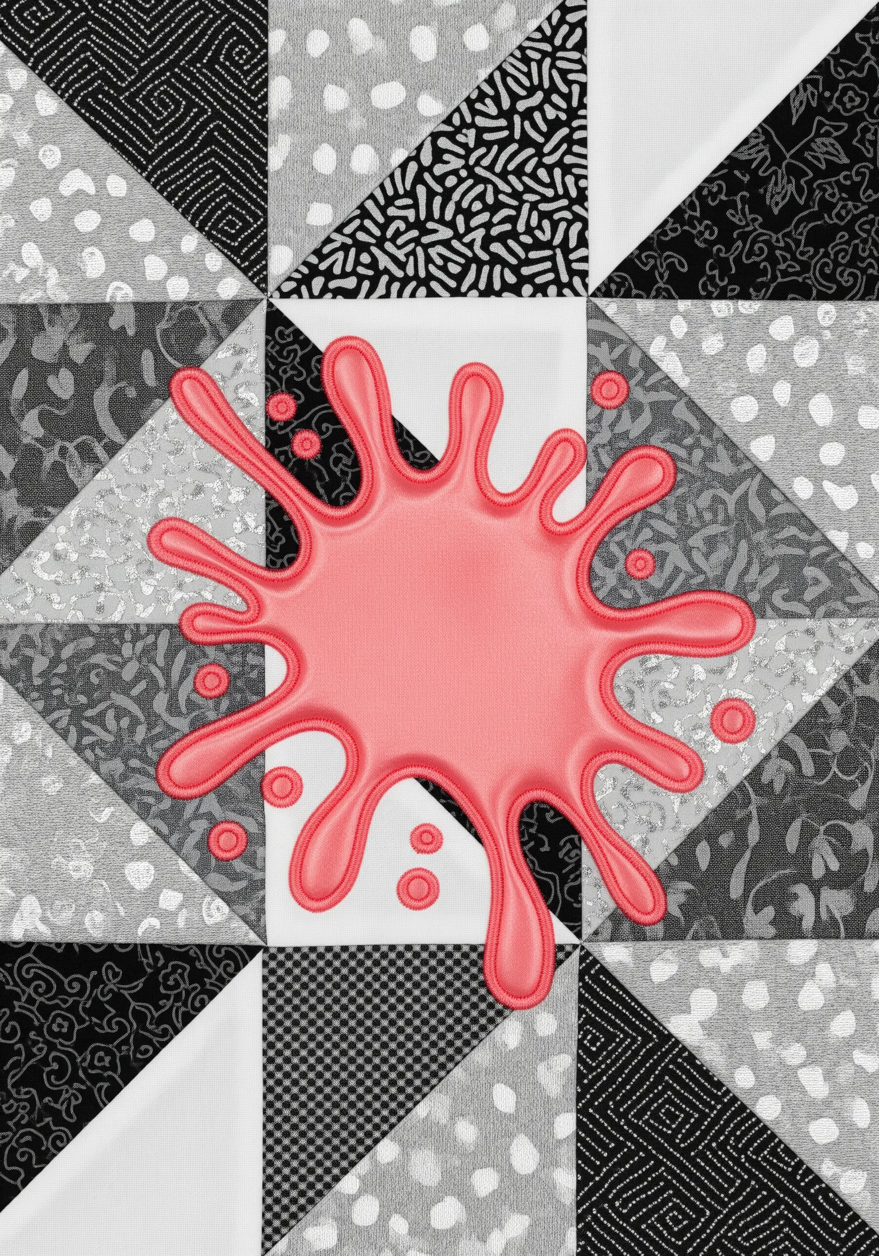 Monochrome geometric quilt interrupted by a bright pink, 3D padded appliqué 'splat' shape.