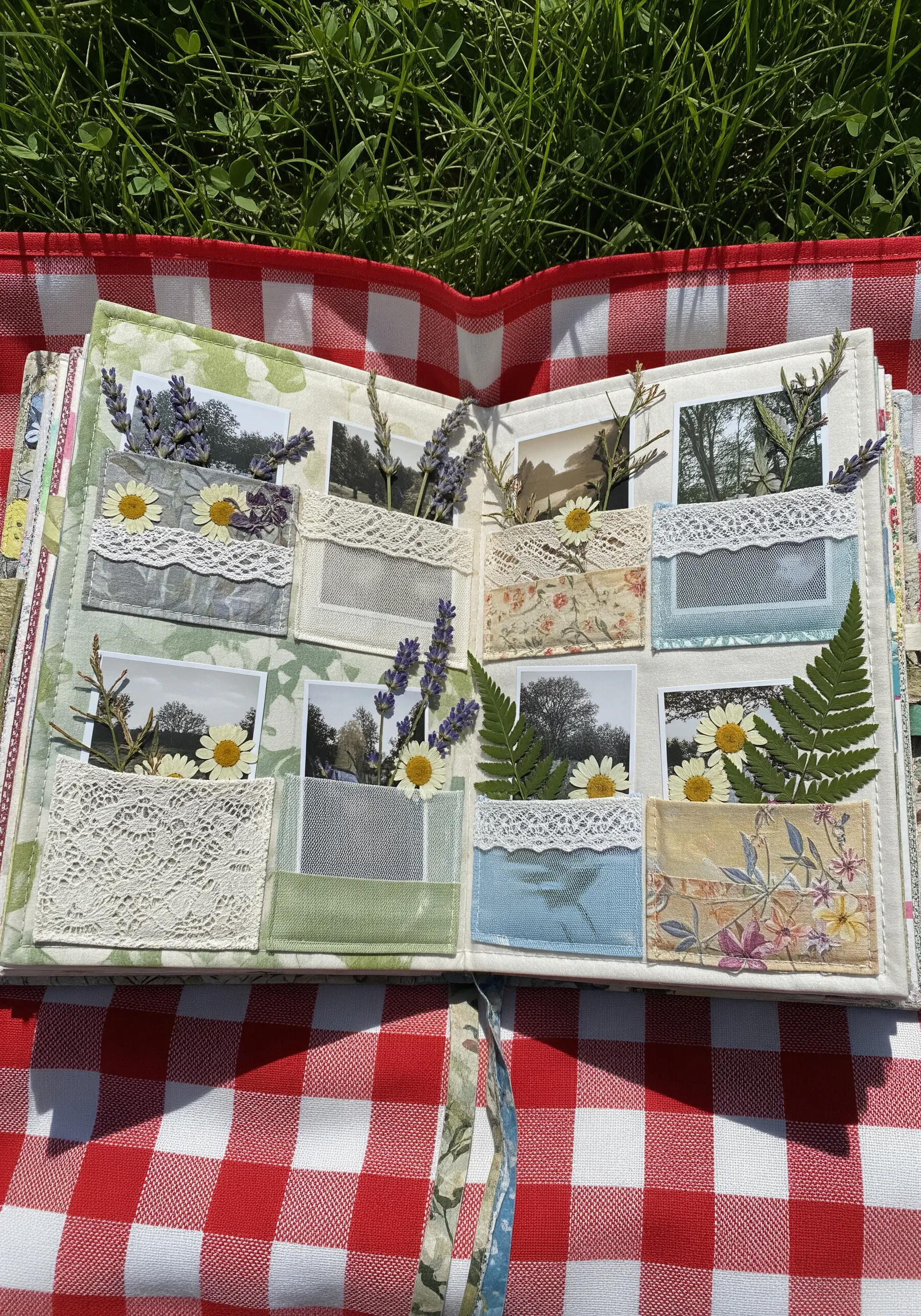 Fabric book with lace pockets for photos