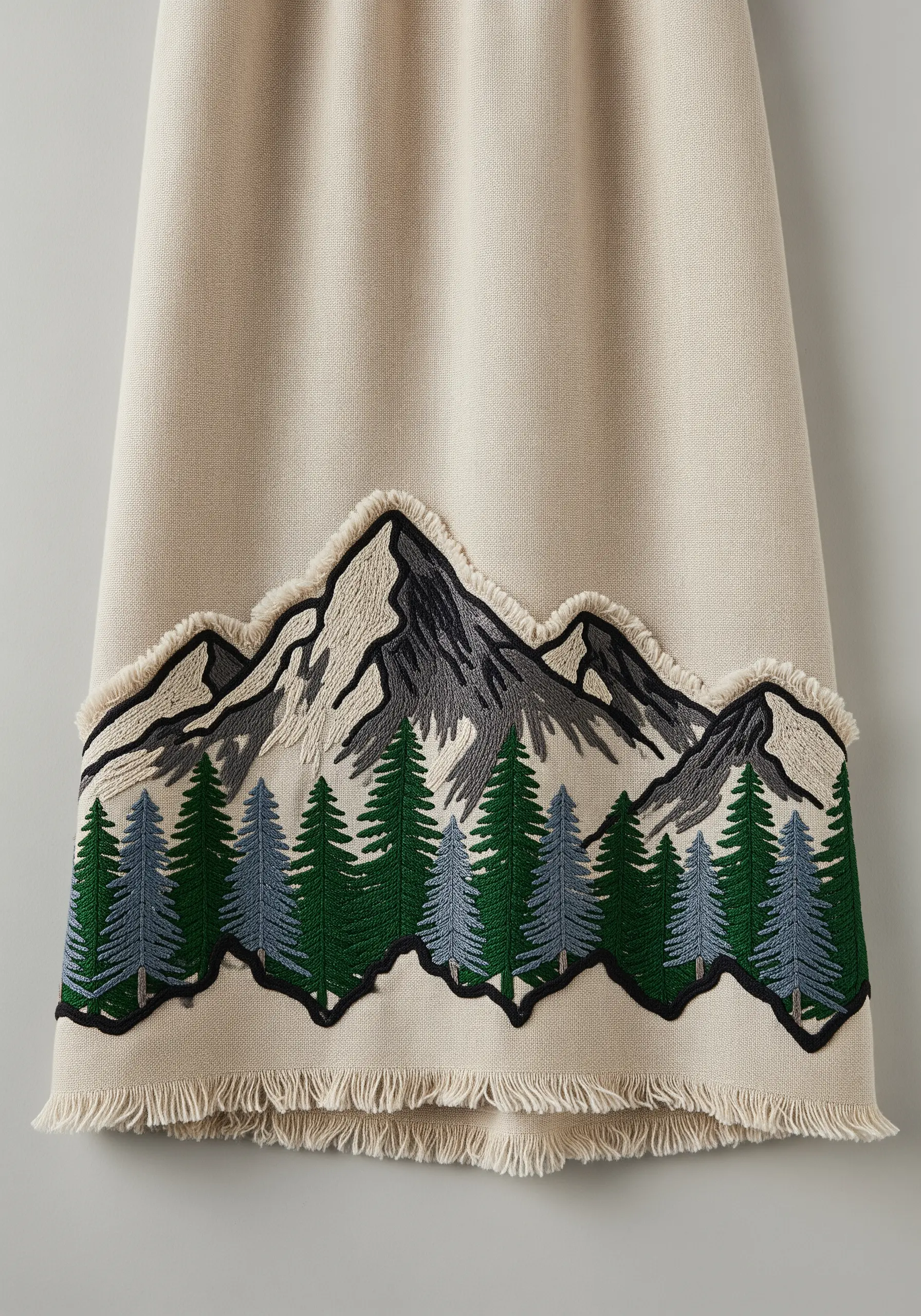 Beige linen dress with embroidered mountain range and pine trees
