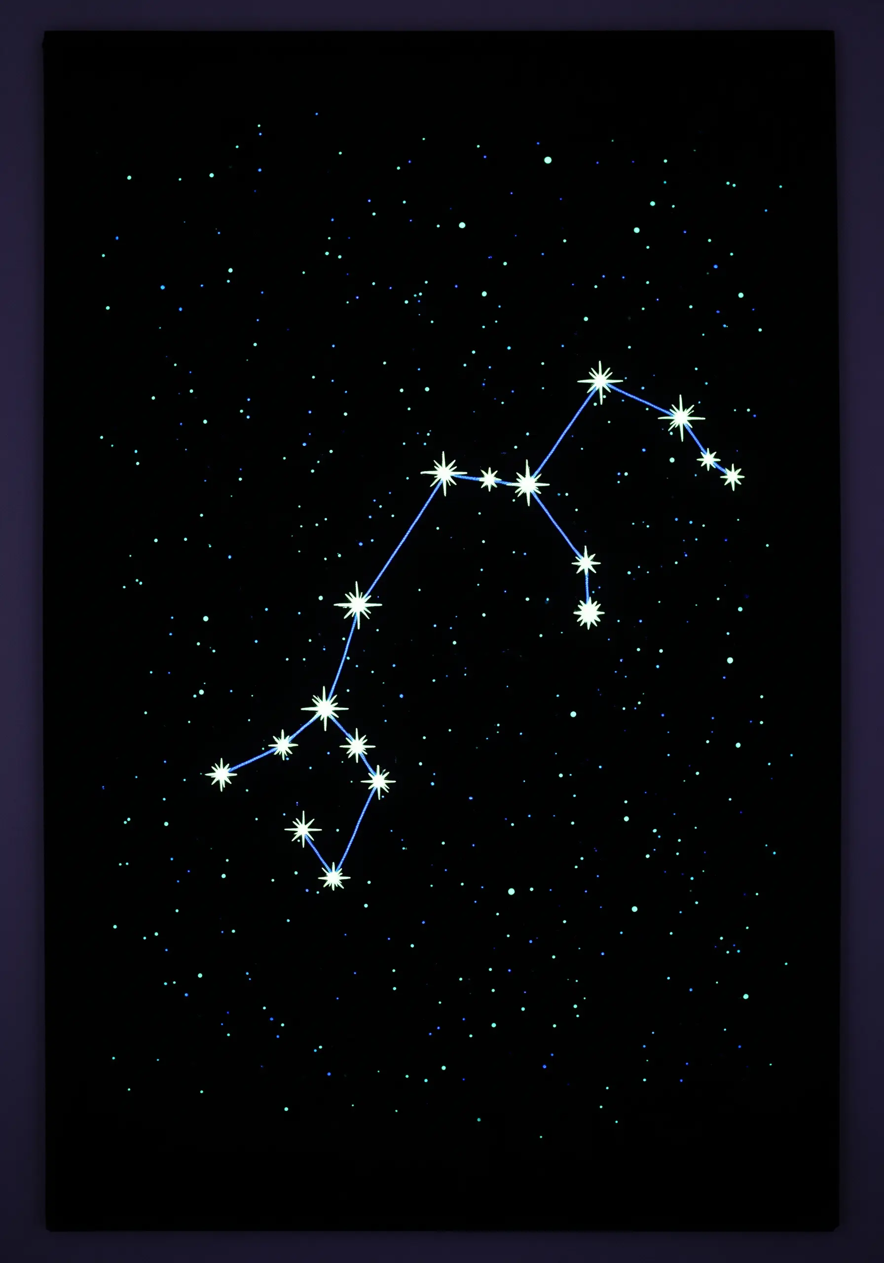A constellation stitched with glowing stars and blue lines on a black, speckled background.