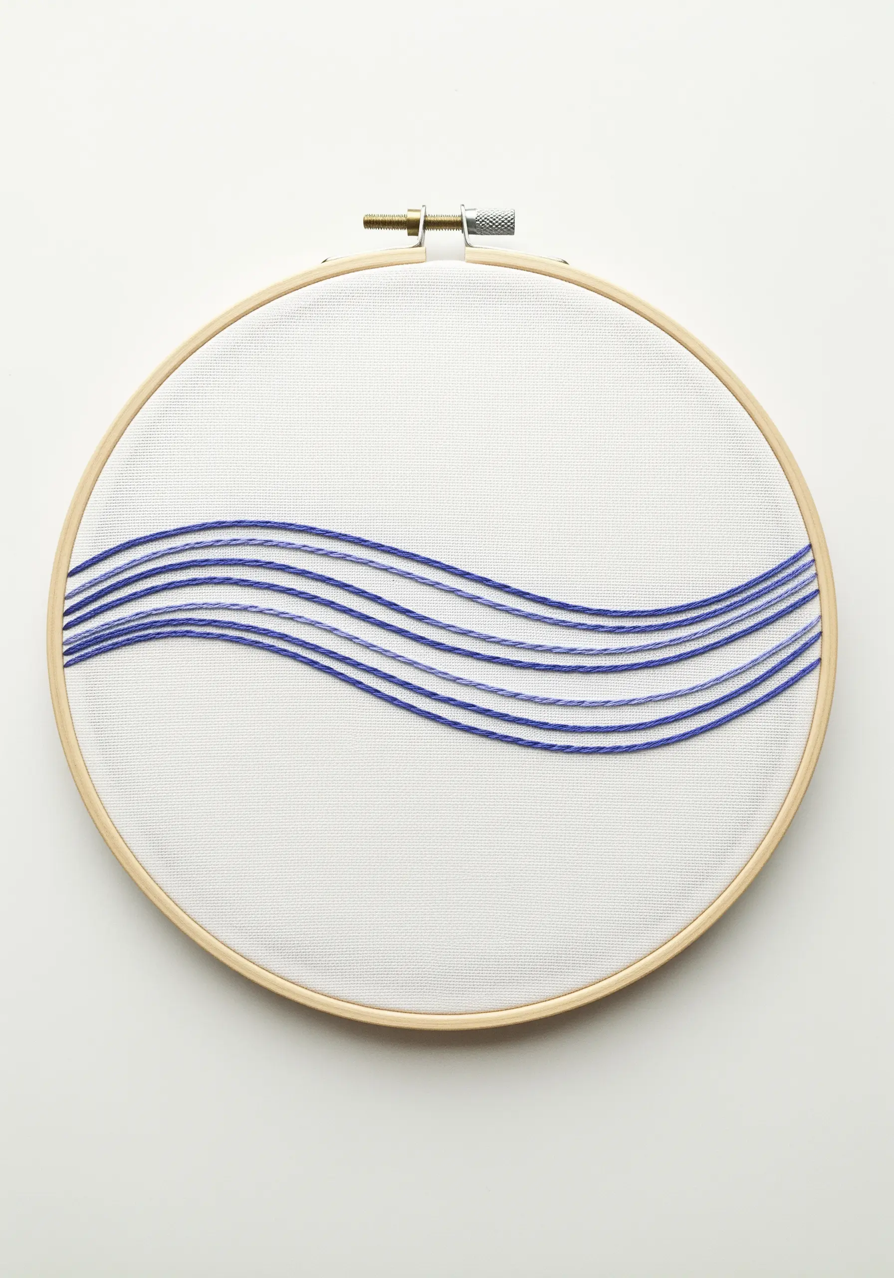 Minimalist hoop art featuring five parallel wavy blue lines on a white background.