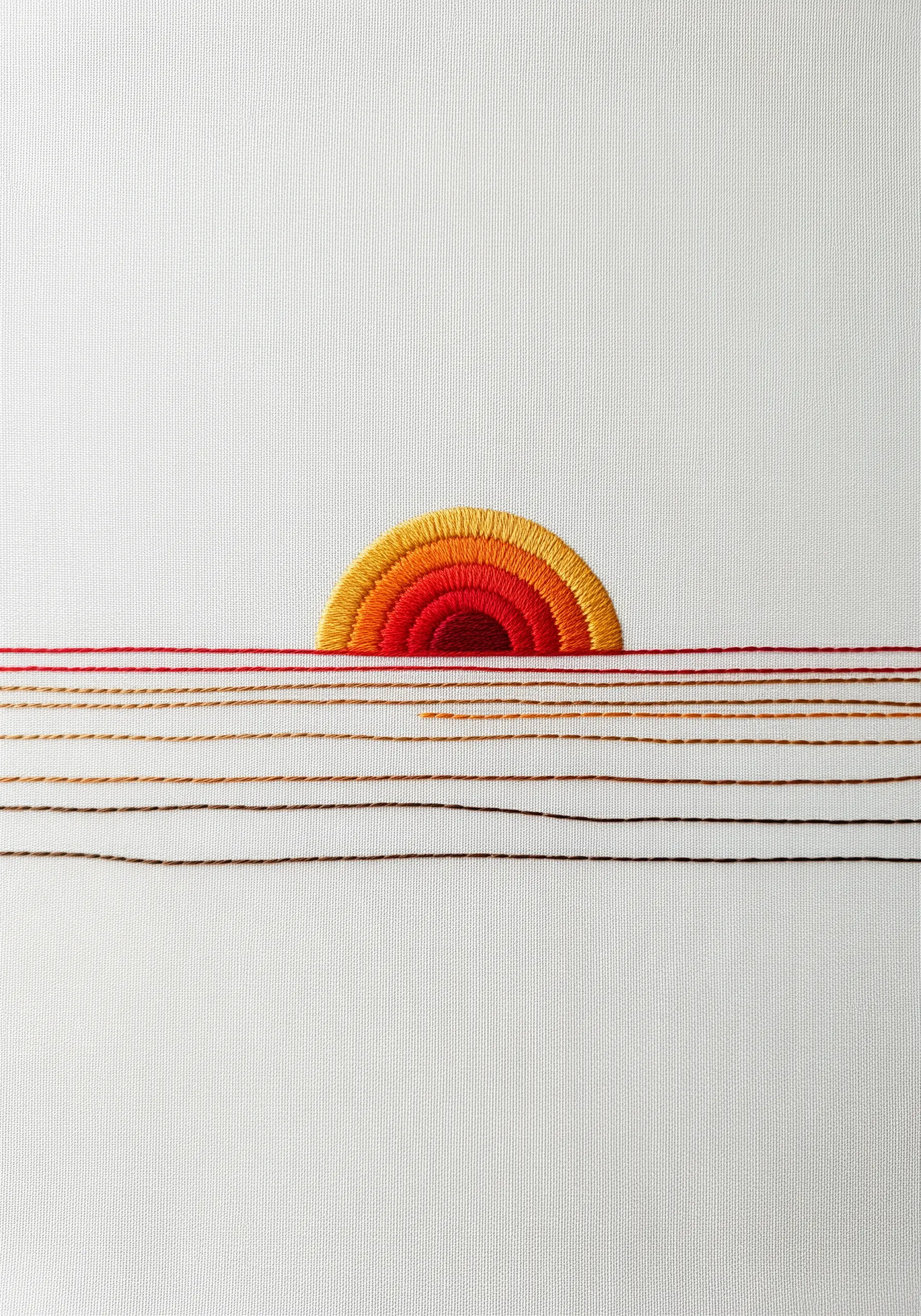 A minimalist embroidered sunset with a satin-stitched sun and long, loose horizontal threads.