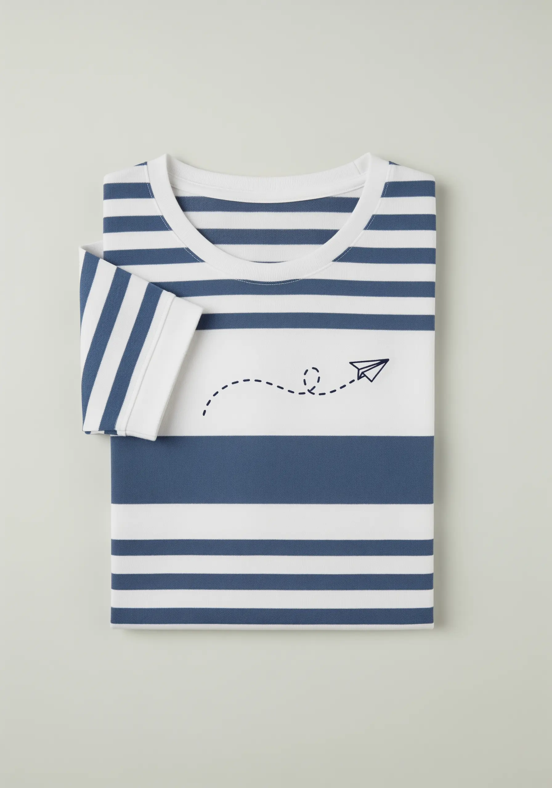A simple backstitch paper airplane with a dotted flight path on a striped shirt.