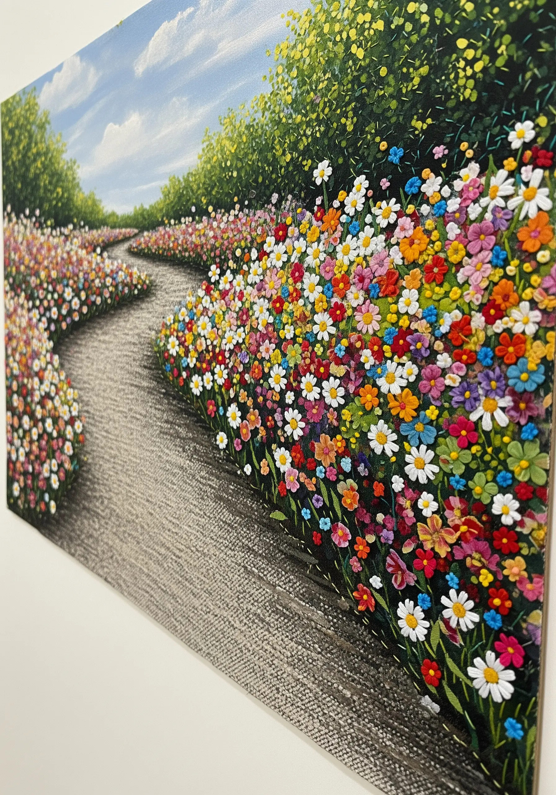 A dimensional flower field landscape created with dense clusters of colorful French knots.