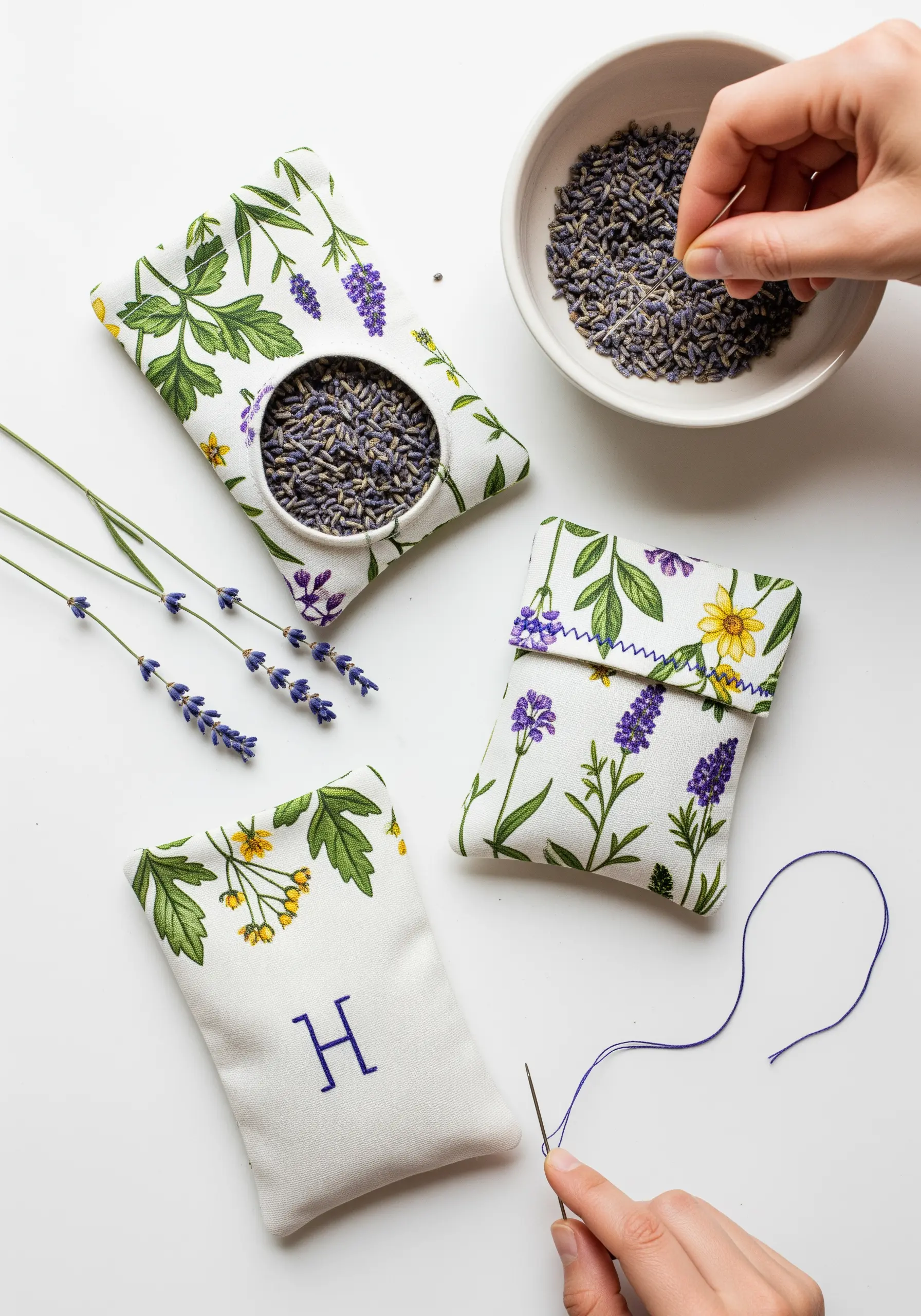 Adding a hand-stitched monogram to a lavender-filled sachet with floral print