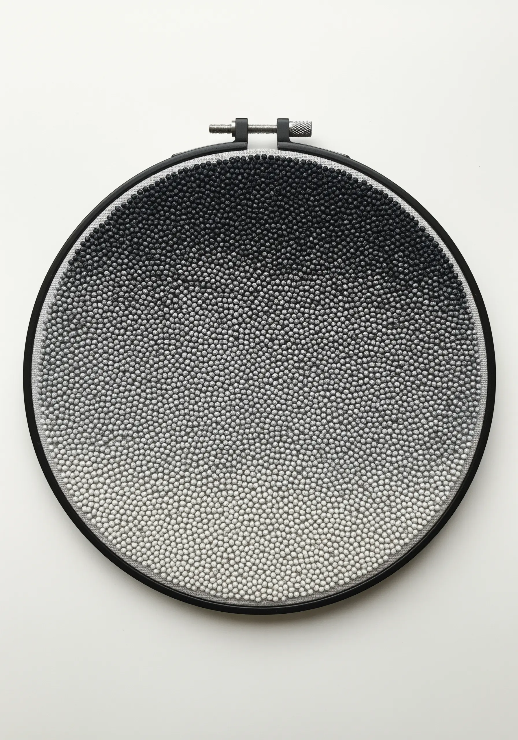A dense field of French knots in a black-to-white gradient.