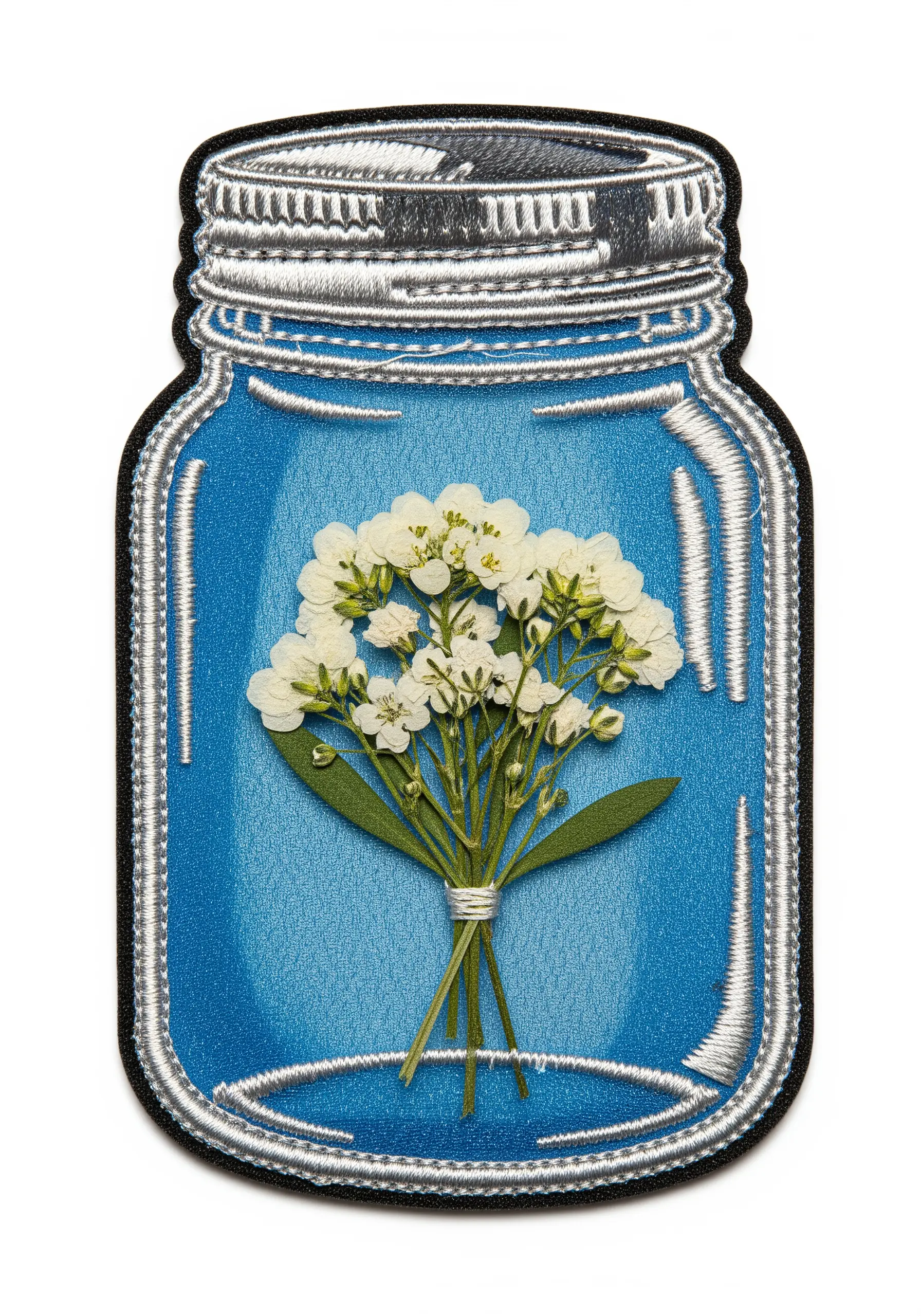 An embroidered patch shaped like a mason jar, with real pressed baby's breath inside.
