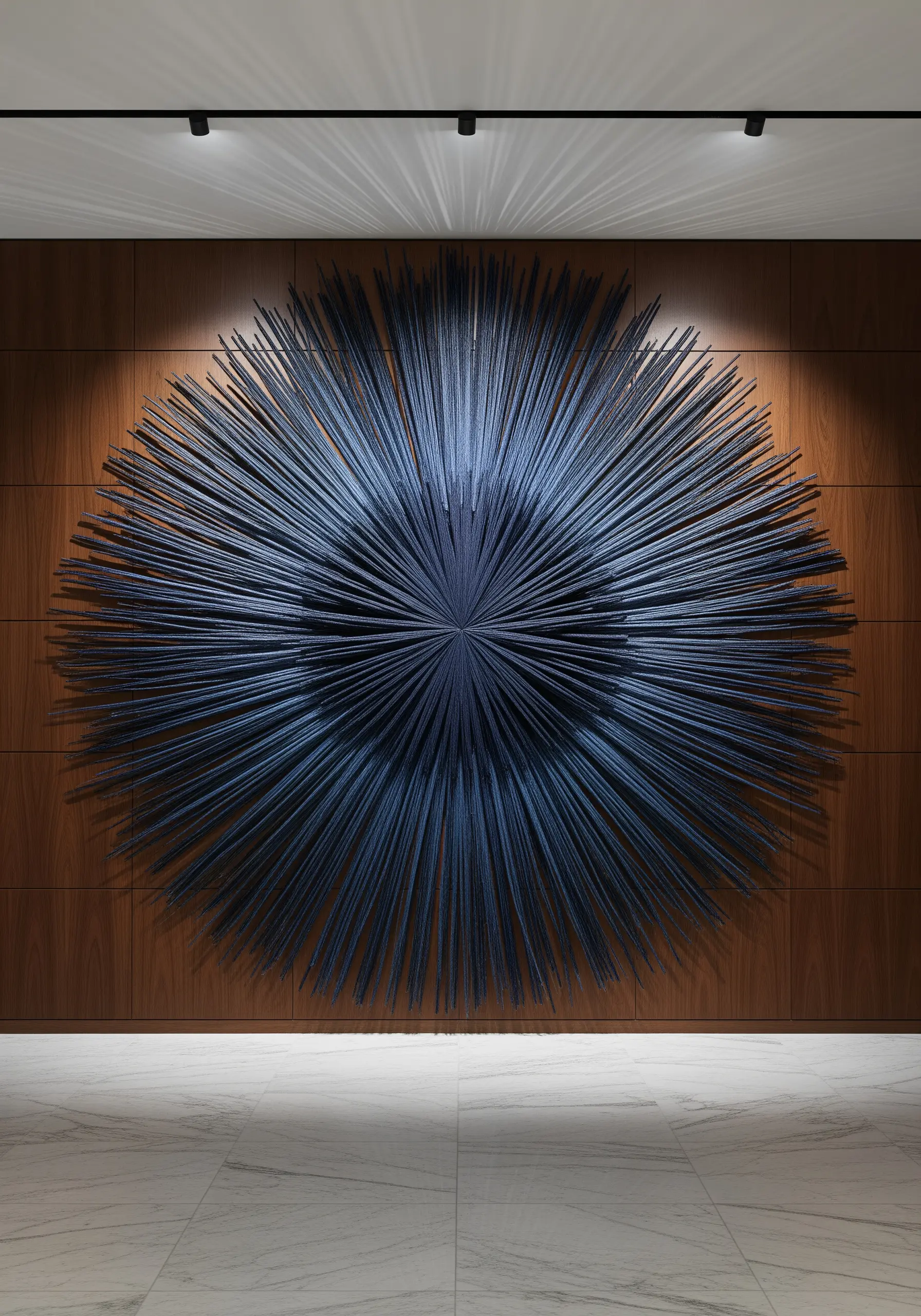 Dark blue radial string art on wood panels with precise lines
