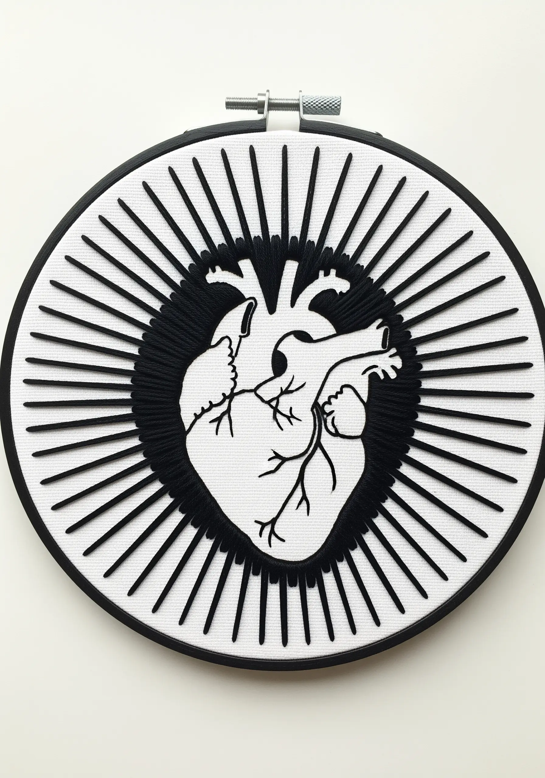 Anatomical heart in negative space, framed by a black halo and radiating black stitches.