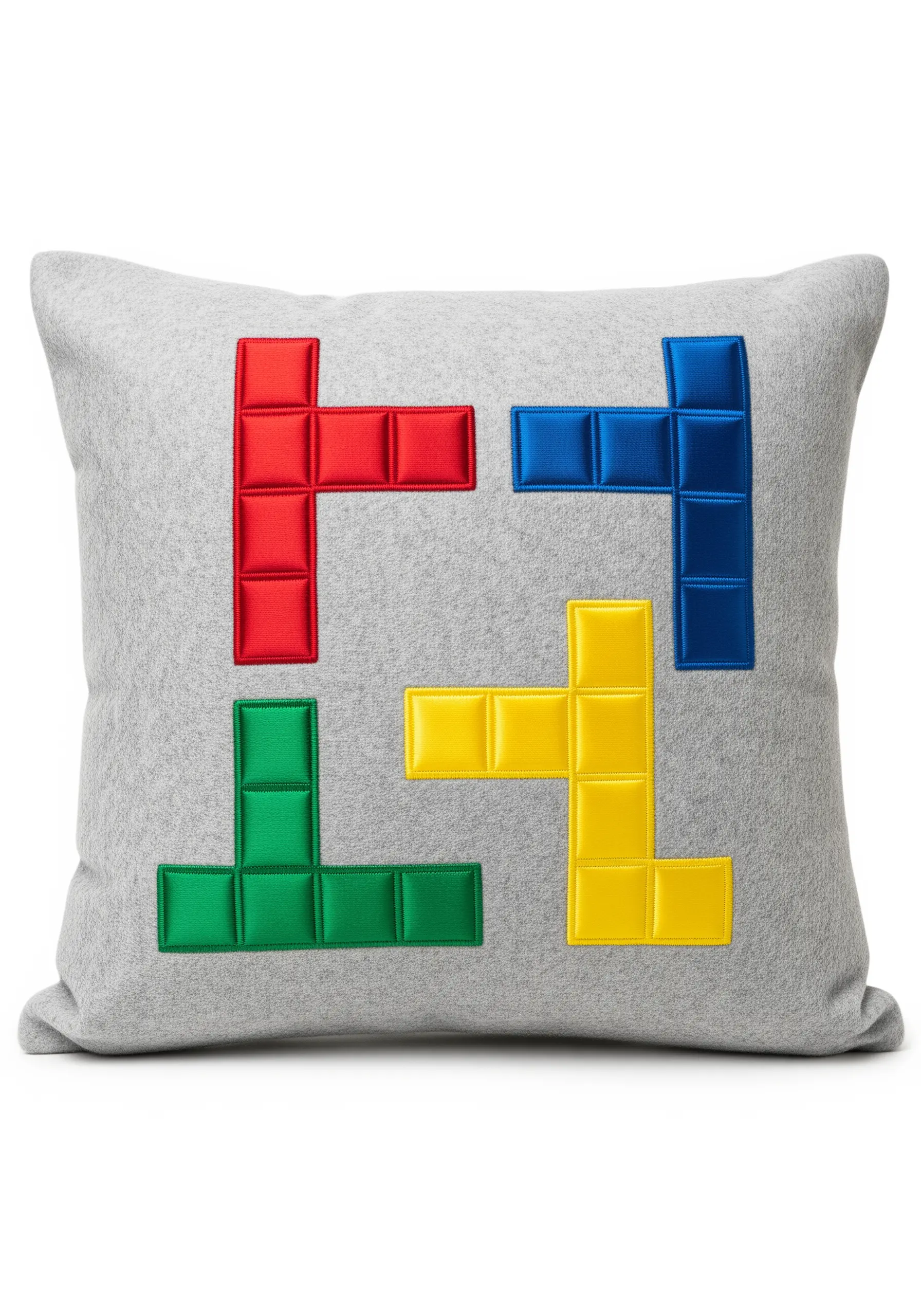 Padded appliqué Tetris-style blocks in primary colors on a gray felt pillow.