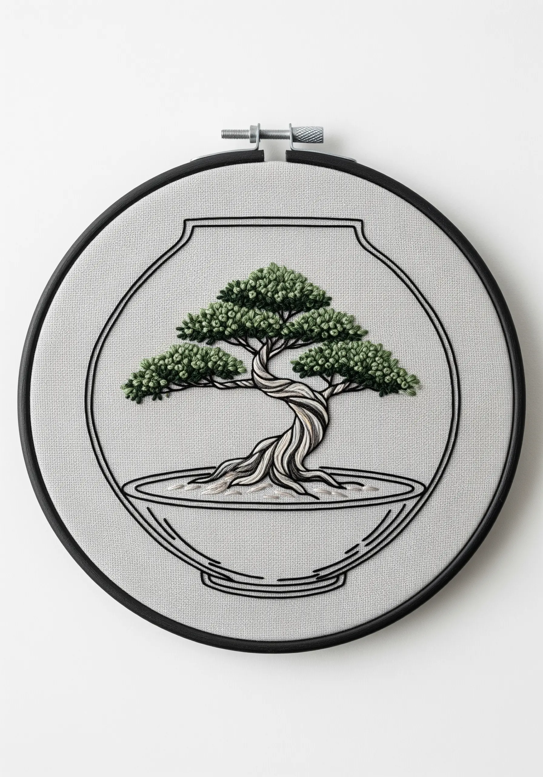 Embroidered bonsai tree in a terrarium with a twisted trunk and dense foliage