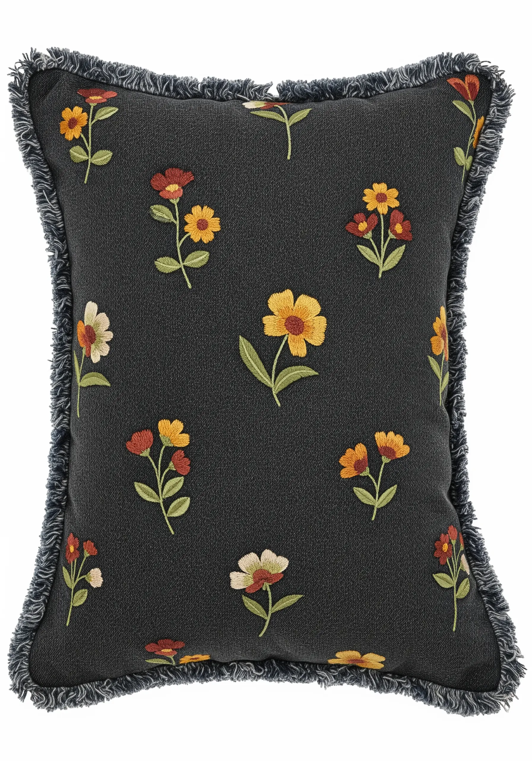 A dark gray pillow with a scattered pattern of small, colorful embroidered flowers.